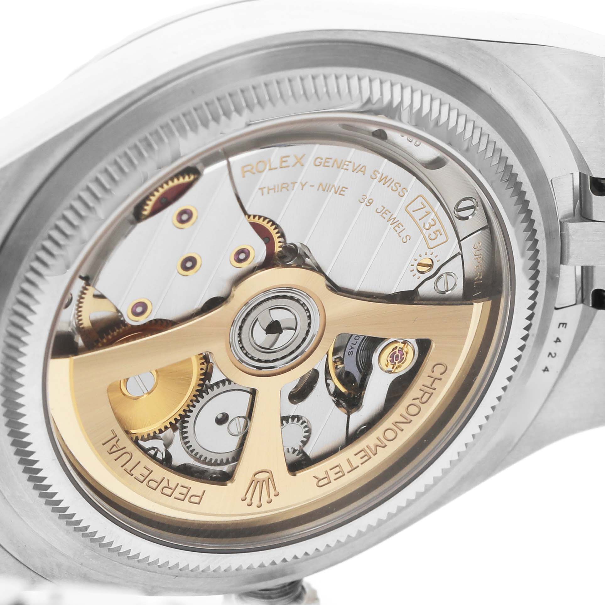 The Rolex Land‑Dweller 127334 Men's Stainless Steel White Dial is shown from the back, displaying its intricate mechanical movement and rotor.