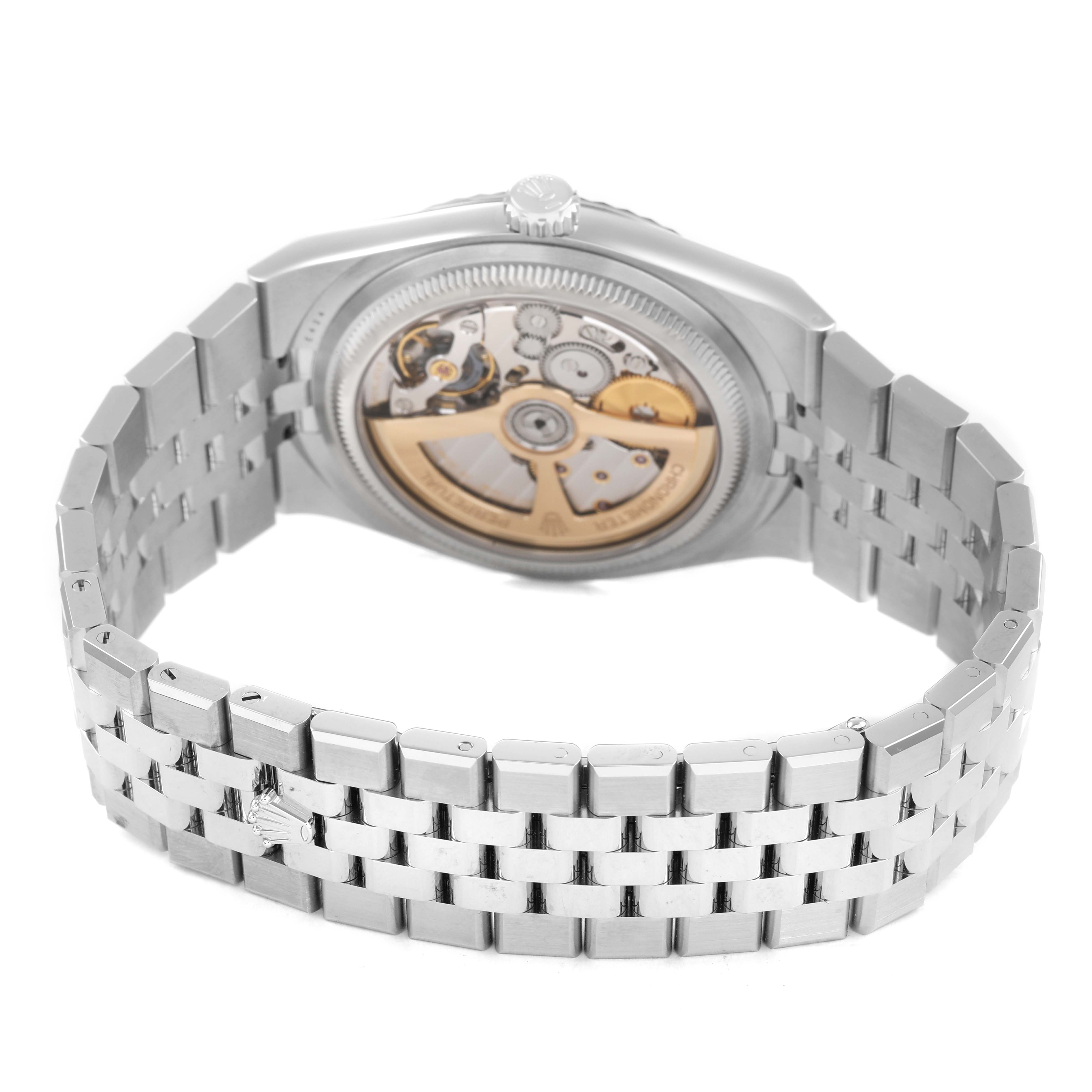 The Rolex Land‑Dweller 127334 Men's Stainless Steel White Dial is shown from the back, highlighting its open case back and bracelet.