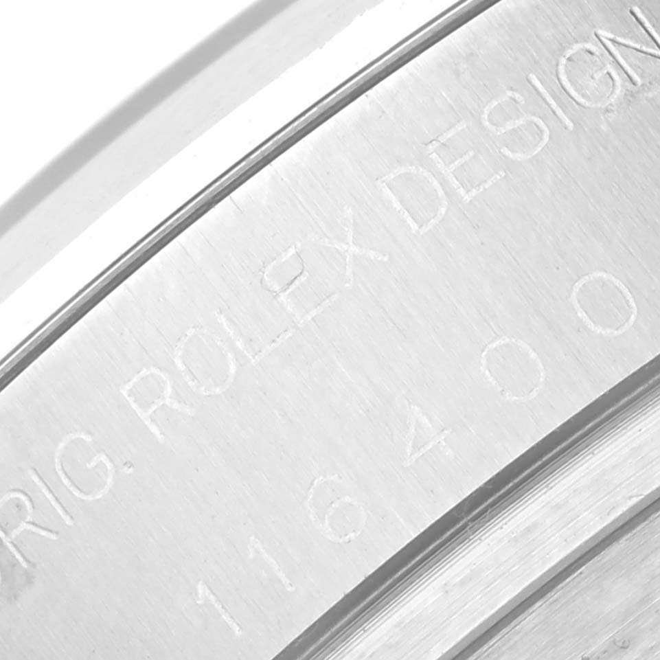The image shows a close-up of the caseback edge engraving of the Rolex Milgauss 116400 Men's Stainless Steel Black Dial 116400 Men's Stainless Steel Black Dial watch, displaying the model number and "ROLEX DESIGN."