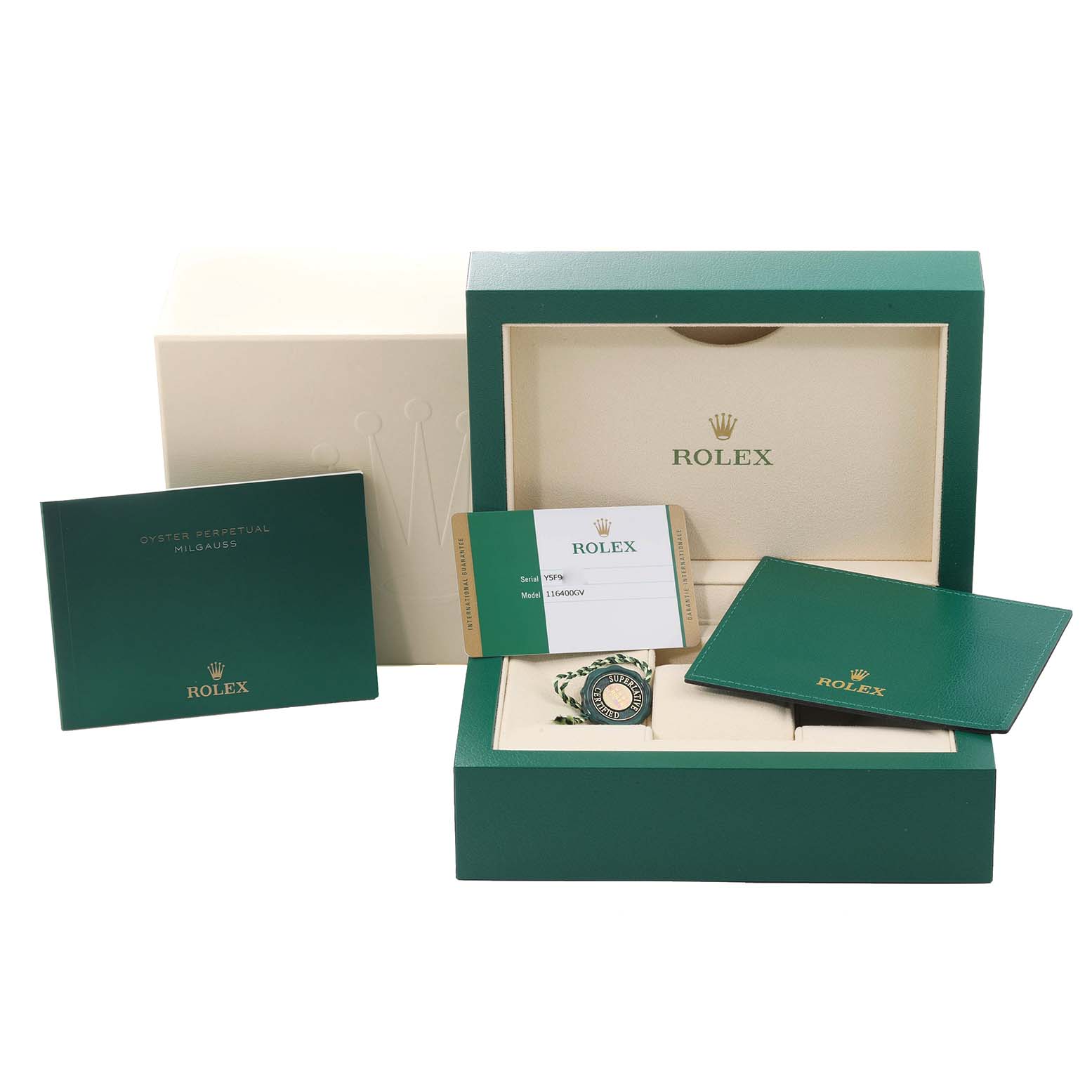 The image shows the packaging and paperwork for a Rolex Milgauss 116400 Men's Stainless Steel Blue Dial 116400 Men's Stainless Steel Blue Dial model, including the box, booklet, and warranty card.
