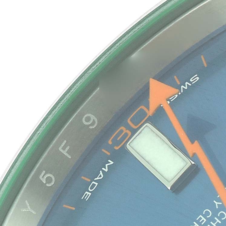 The image shows a close-up of the dial and minute markers of a Rolex Milgauss 116400 Men's Stainless Steel Blue Dial 116400 Men's Stainless Steel Blue Dial watch, highlighting the orange lightning bolt second hand.