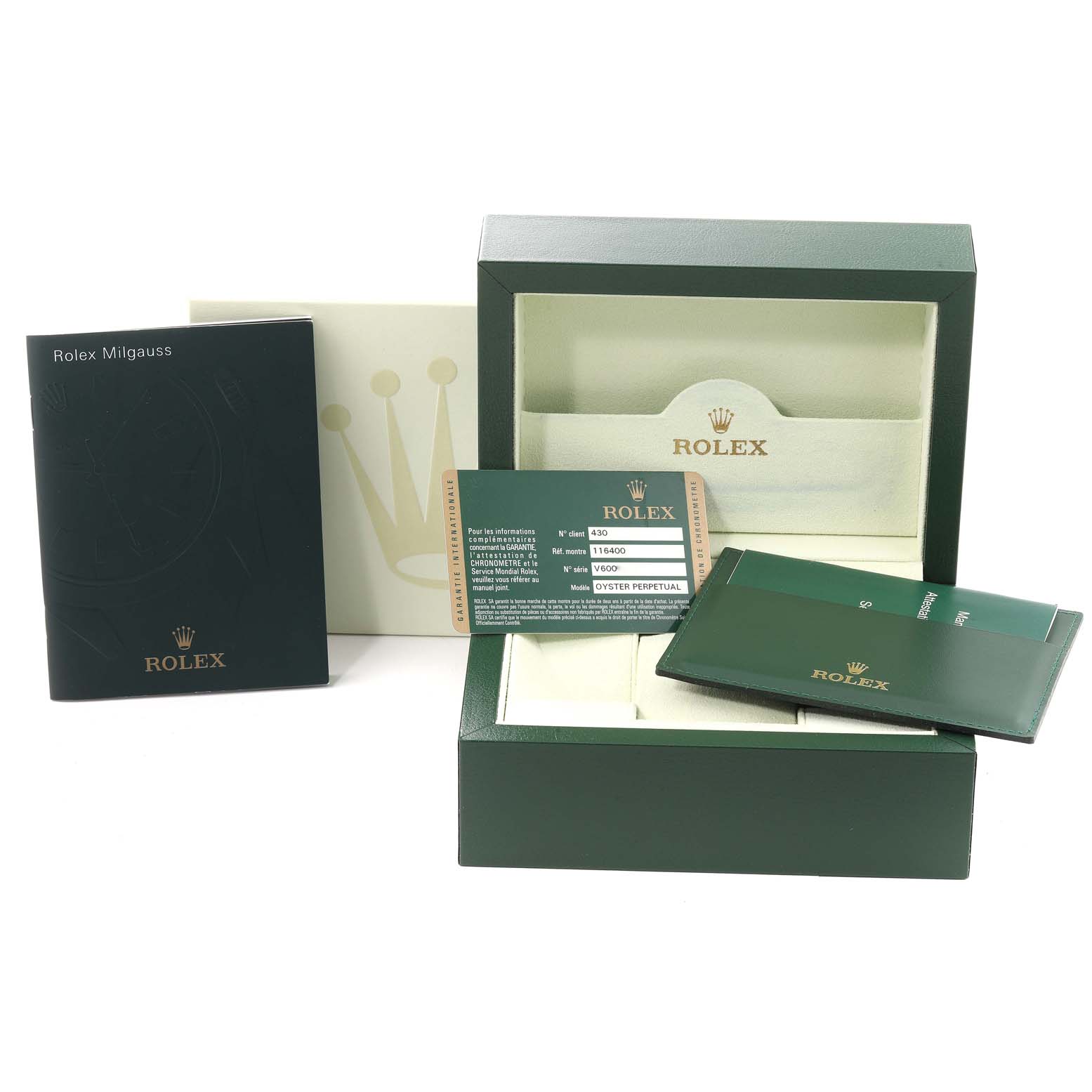 The image shows the packaging and accessories of the Rolex Milgauss 116400 Men
s Stainless Steel White Dial 116400 Men
s Stainless Steel White Dial watch, including the box, manuals, and warranty card.