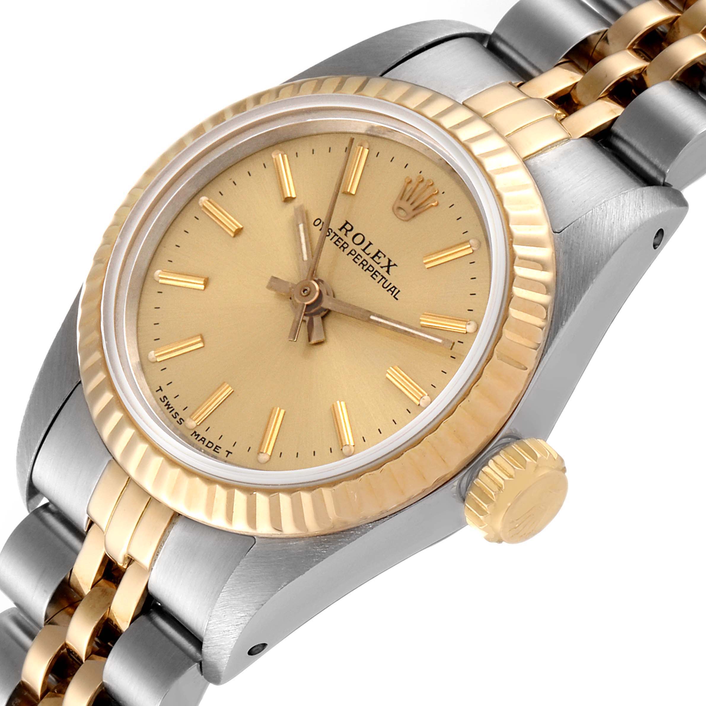 The image shows a Rolex Oyster Perpetual 67193 Women
s Steel and Gold (two tone) Champagne Dial 67193 Women
s Steel and Gold (two tone) Champagne Dial watch from a three-quarter angle, displaying the dial, bezel, crown, and part of the bracelet.