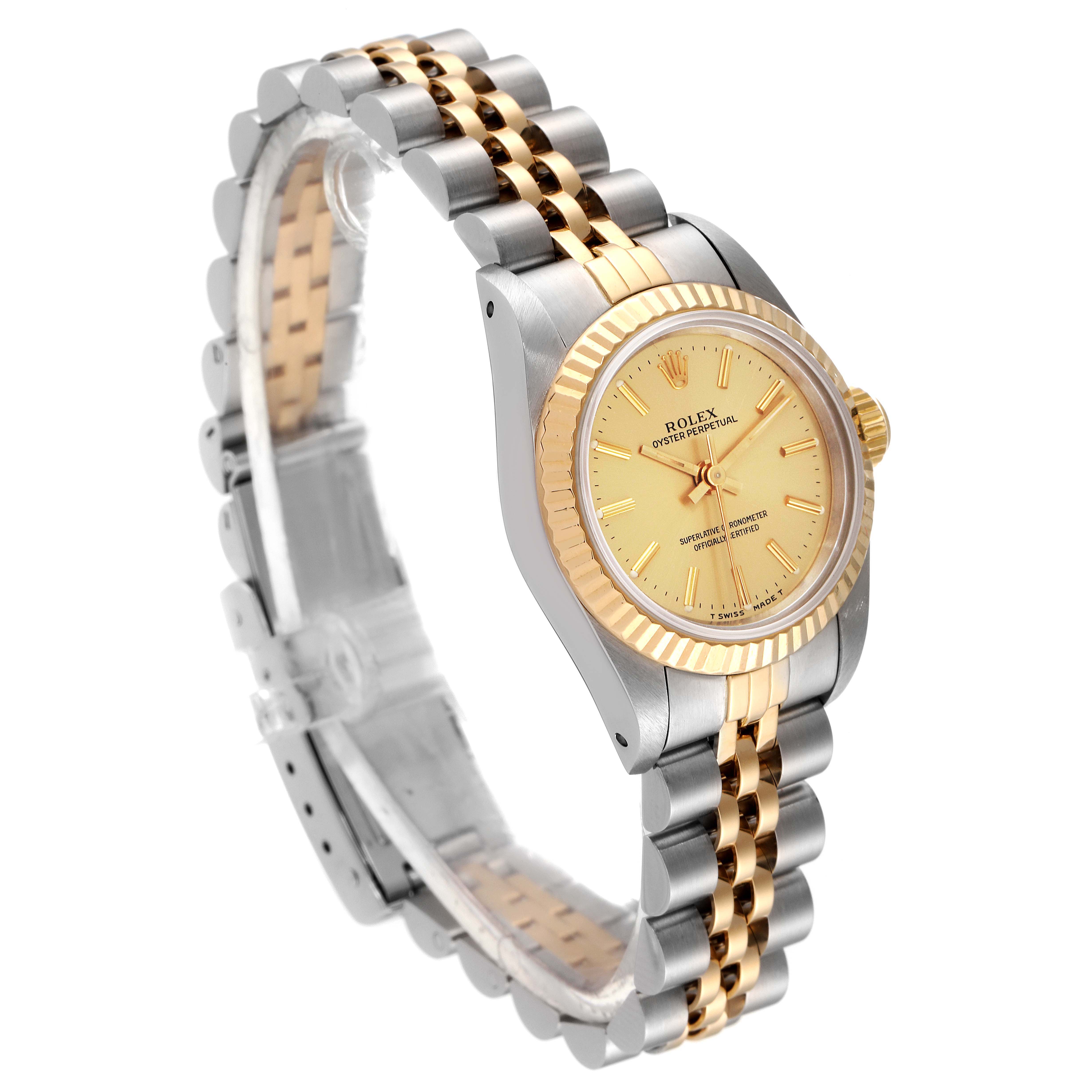The image shows a side angle of the Rolex Oyster Perpetual 67193 Women
s Steel and Gold (two tone) Champagne Dial 67193 Women
s Steel and Gold (two tone) Champagne Dial watch, highlighting the two-tone bracelet and gold-tone dial.