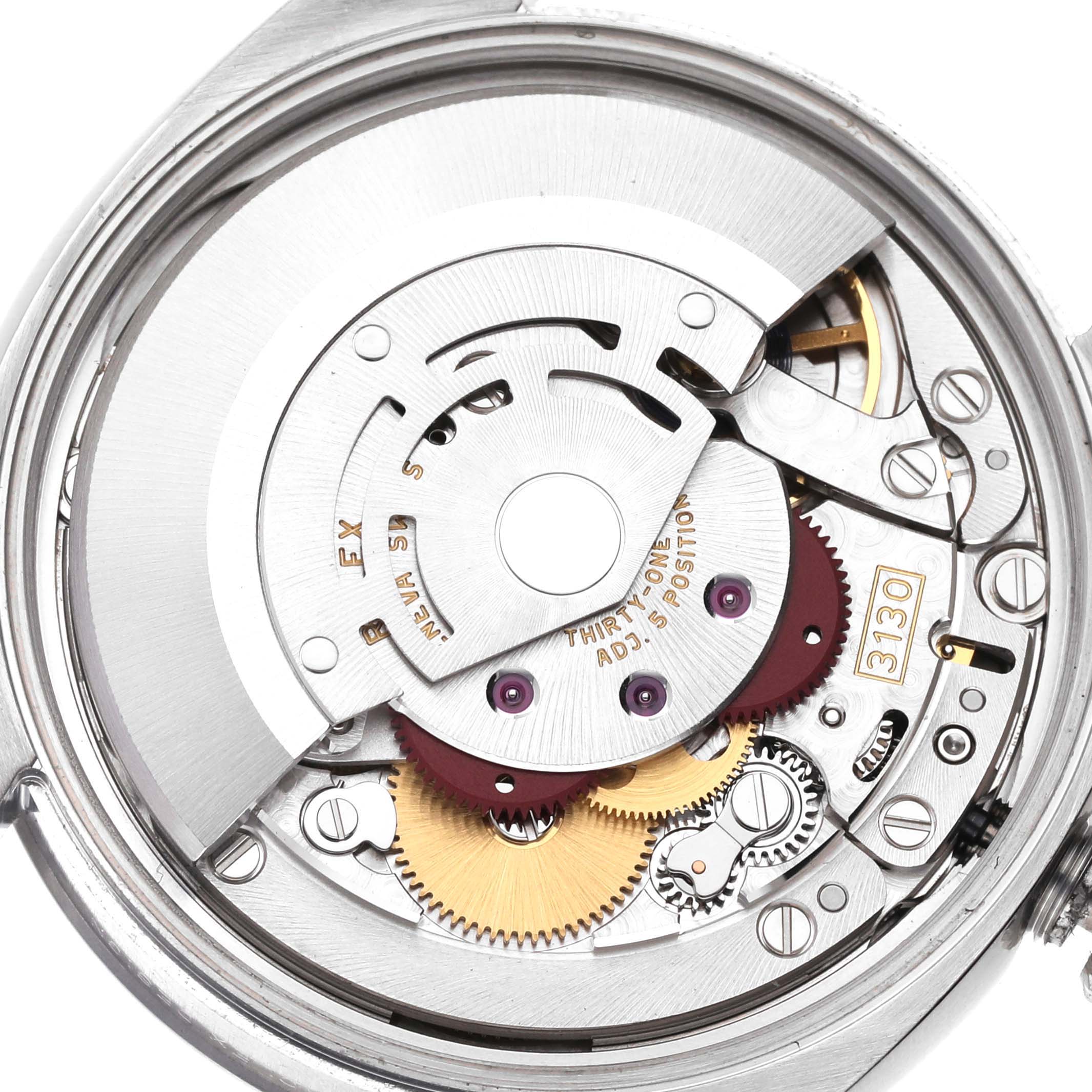 This image shows the inner mechanical movement components of a Rolex Oyster Perpetual 114200 Men
s Stainless Steel Silver Dial 114200 Men
s Stainless Steel Silver Dial watch from the back.