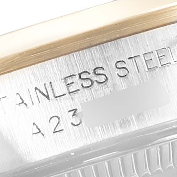 This image shows a close-up of the case side with model engraving of a Rolex Oyster Perpetual 76183 Women
s Steel and Gold (two tone) White Dial 76183 Women
s Steel and Gold (two tone) White Dial watch.