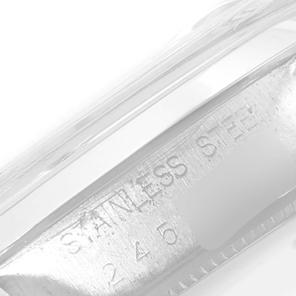 The image shows a close-up of the side of a Rolex Vintage Collection 6694 Men's Stainless Steel Silver Dial 6694 Men's Stainless Steel Silver Dial watch, specifically the stainless steel marking.