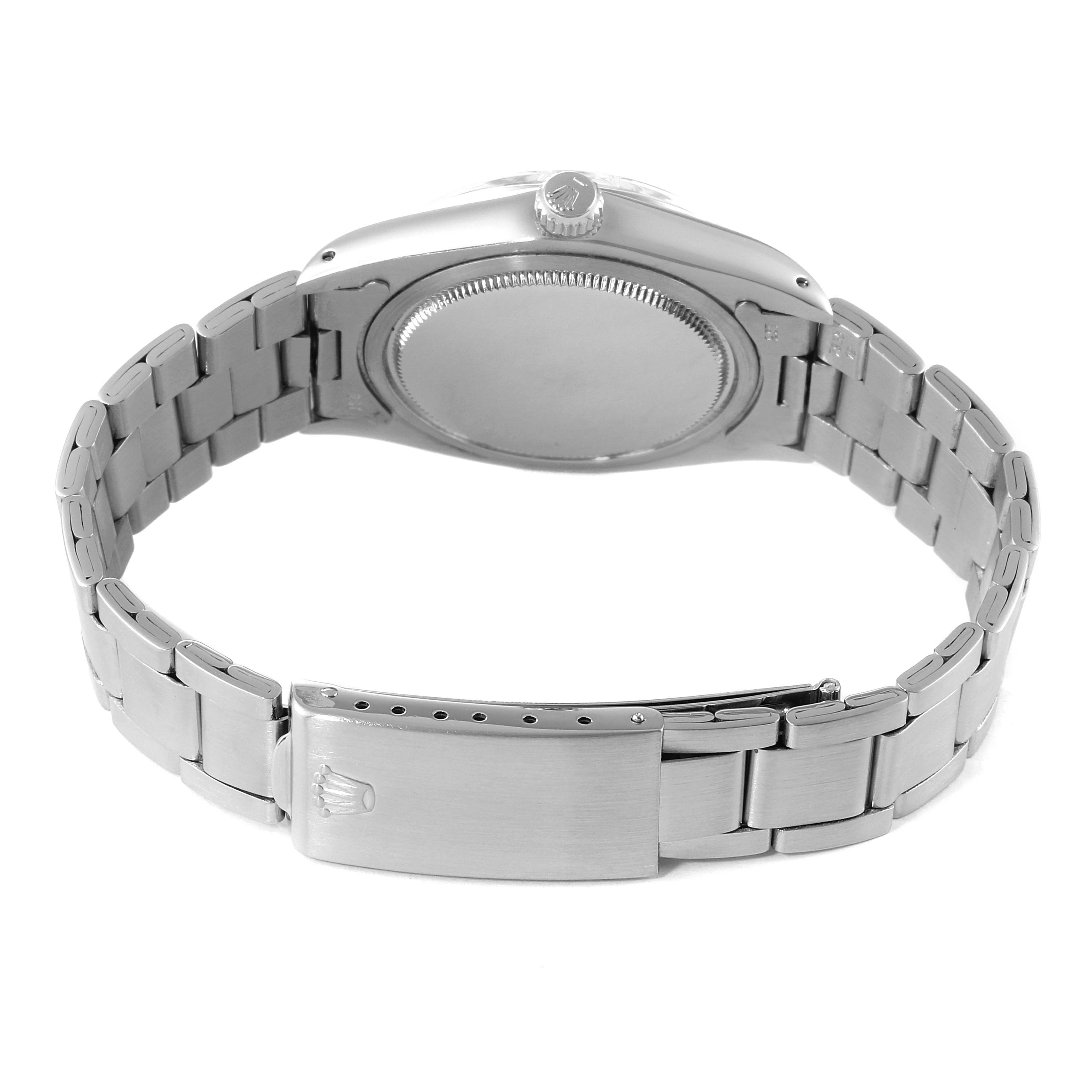 This image shows the back view of a Rolex Vintage Collection 6694 Men's Stainless Steel Silver Dial 6694 Men's Stainless Steel Silver Dial watch, highlighting its case back and metal bracelet with clasp.