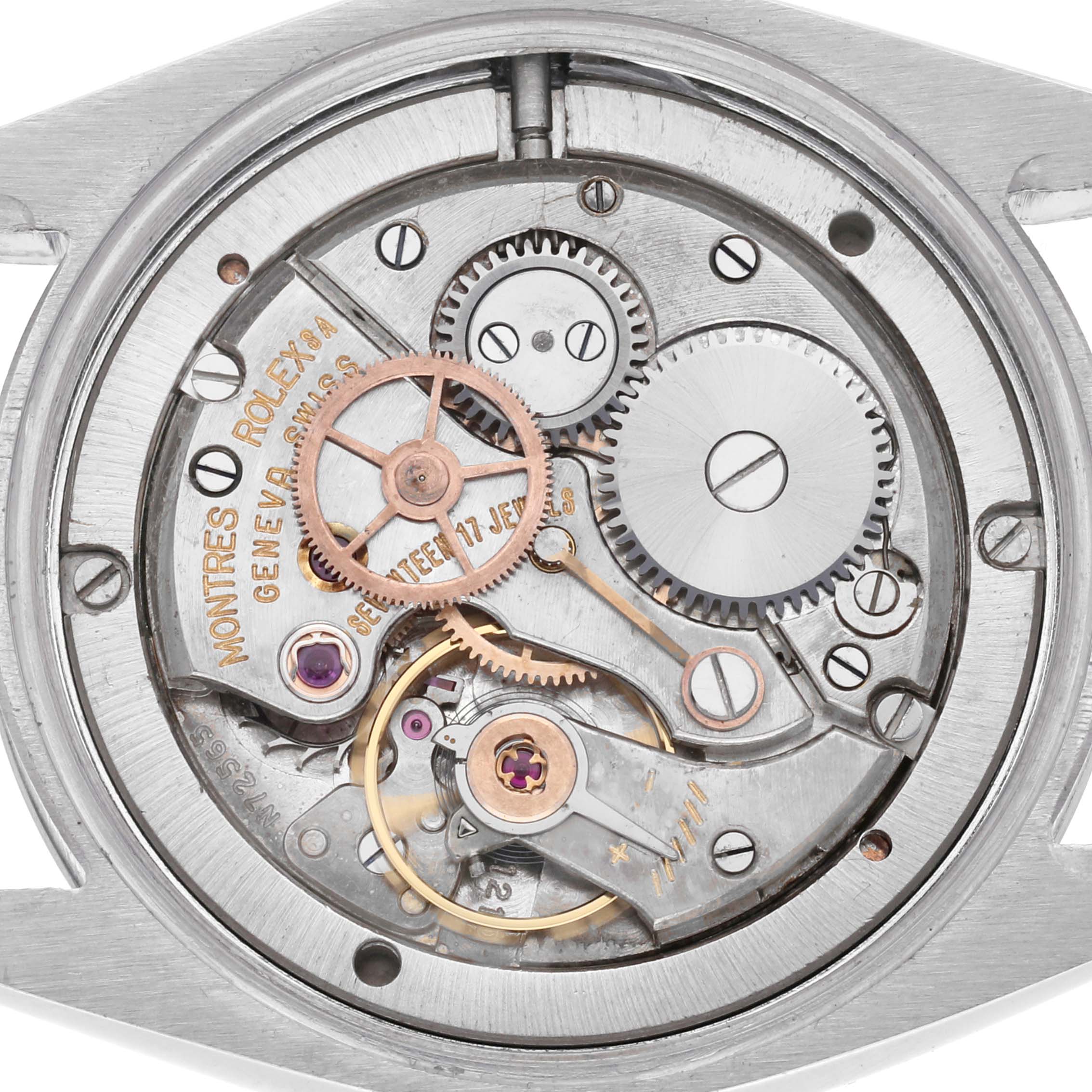 The image shows the movement of a Rolex Vintage Collection 6694 Men
s Stainless Steel Silver Dial 6694 Men
s Stainless Steel Silver Dial model from a top-down angle, revealing gears and components.