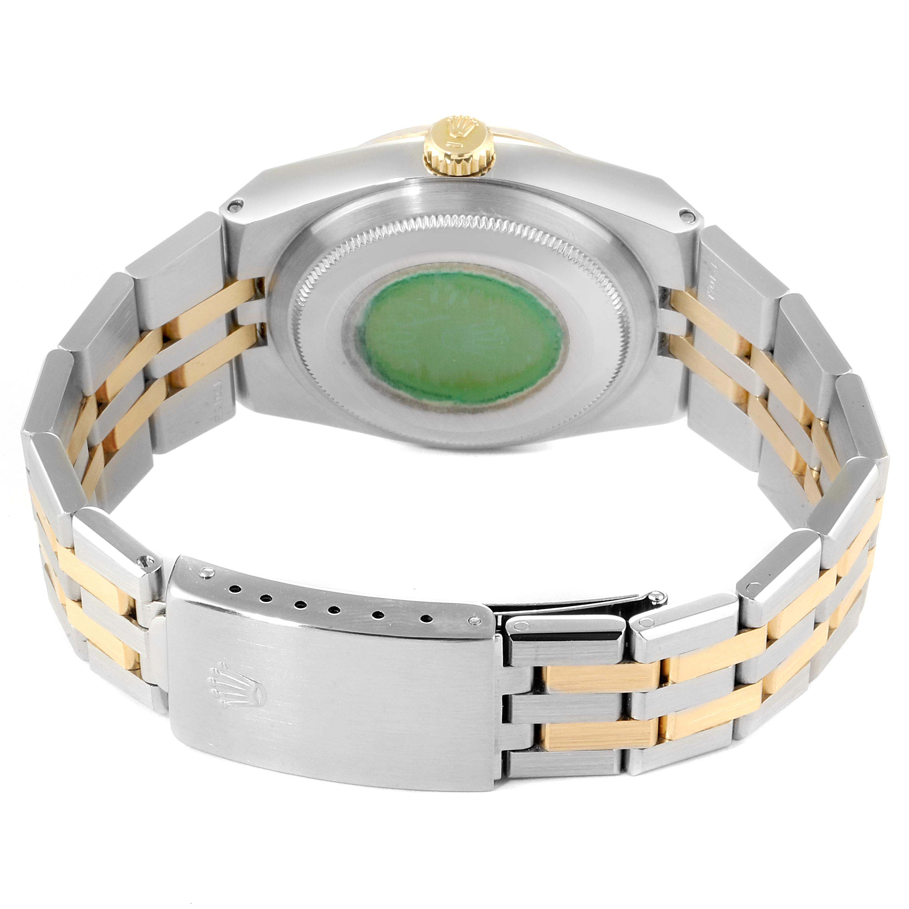 The image shows the back of a Rolex Oysterquartz 17013 Men
s Steel and Gold (two tone) Champagne Dial 17013 Men
s Steel and Gold (two tone) Champagne Dial watch, highlighting its bracelet and clasp.