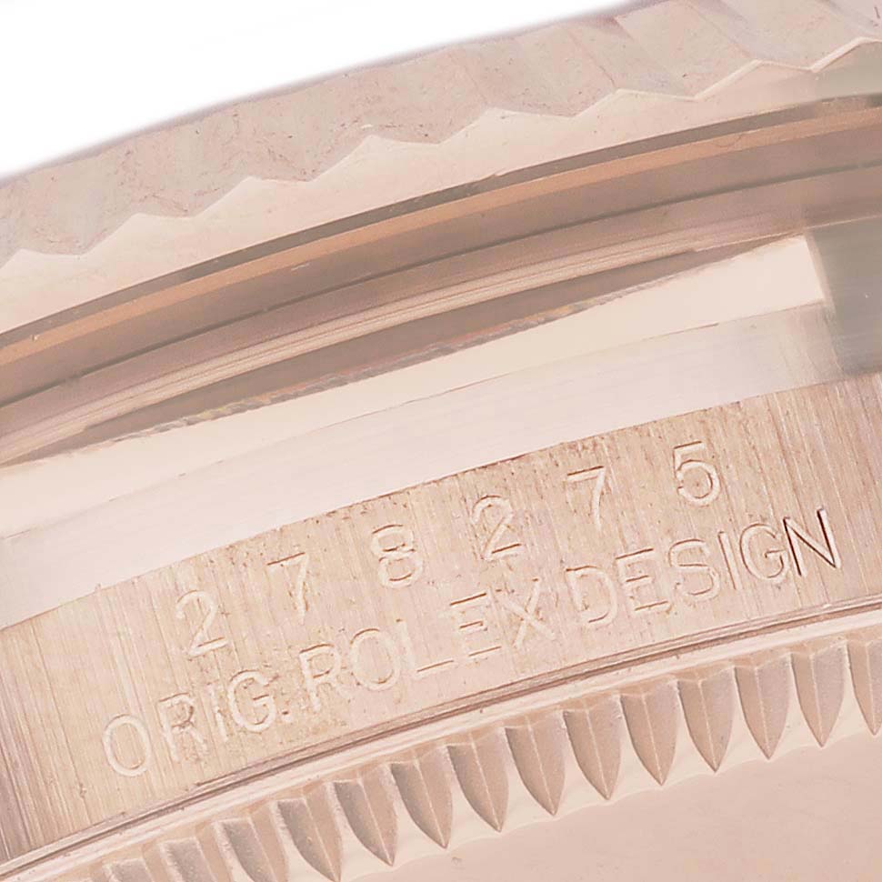 This close-up image shows the engraved serial number and knurled bezel of a Rolex President 278275 Women's Rose Gold Mother of Pearl Dial 278275 Women's Rose Gold Mother of Pearl Dial model watch.