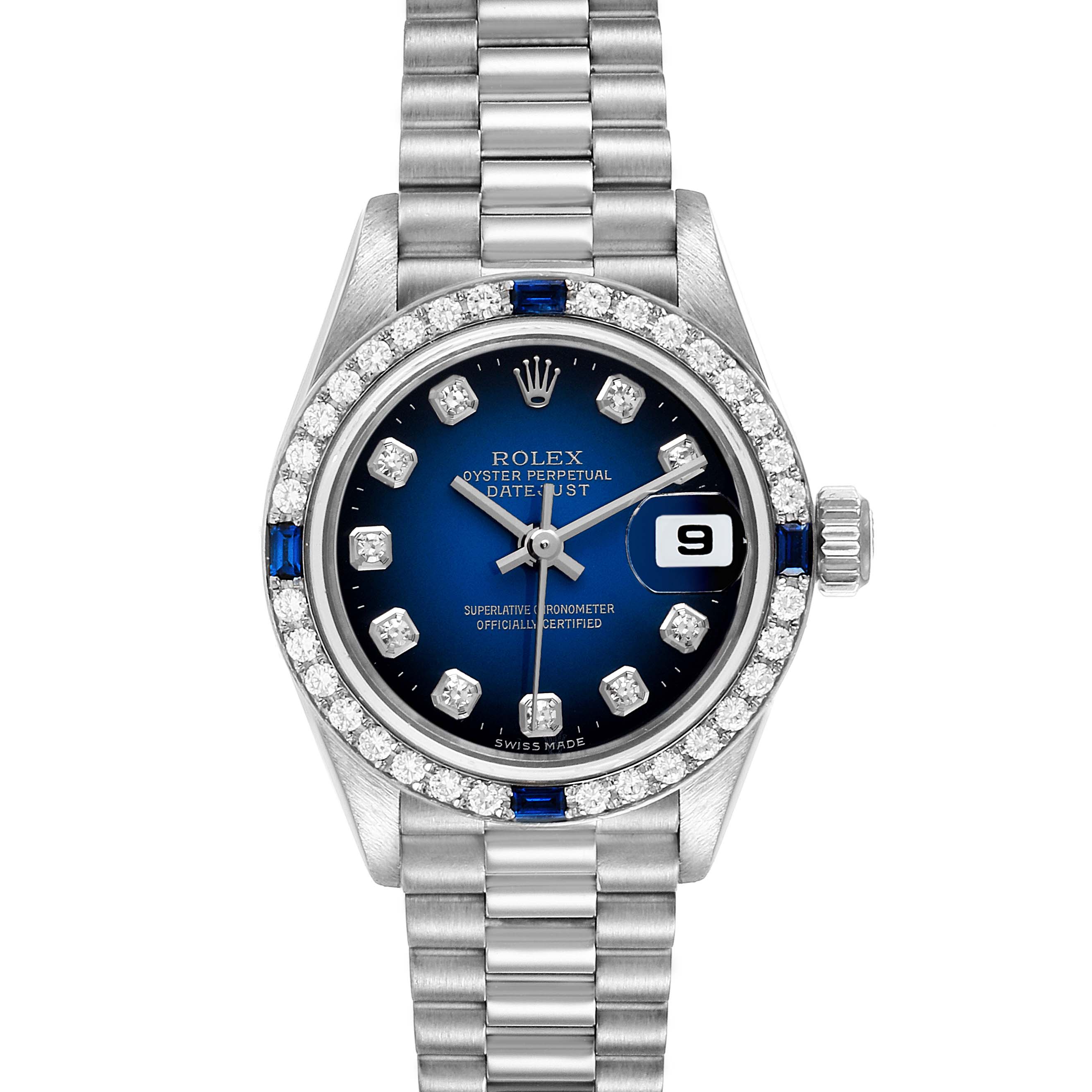 The image shows a frontal view of a Rolex President 79089 Women's White Gold Blue Dial 79089 Women's White Gold Blue Dial model watch, featuring a blue dial, diamond bezel, and President bracelet.