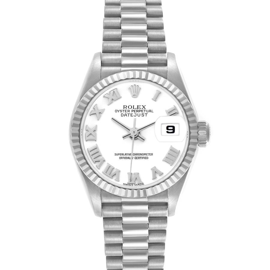 The Rolex President model watch is shown from a top-down angle, displaying its dial, bezel, and bracelet.