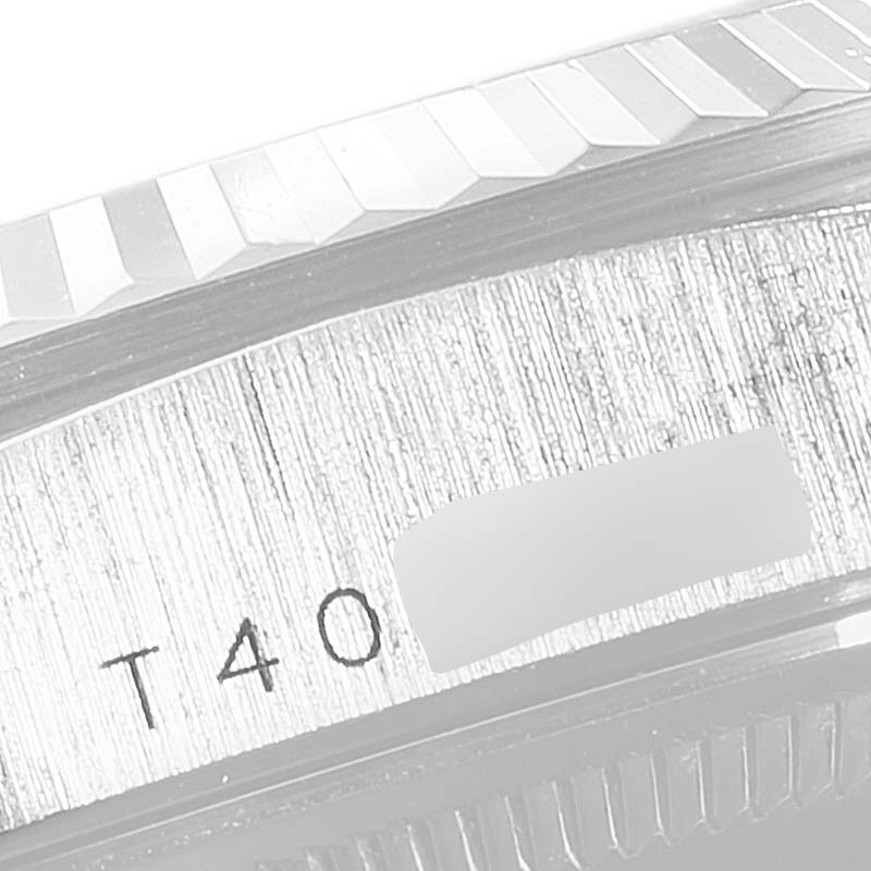 This image shows a detailed close-up of the bezel and a partial view of the serial number on the Rolex President 18239 Men's White Gold Silver Dial 18239 Men's White Gold Silver Dial model watch.