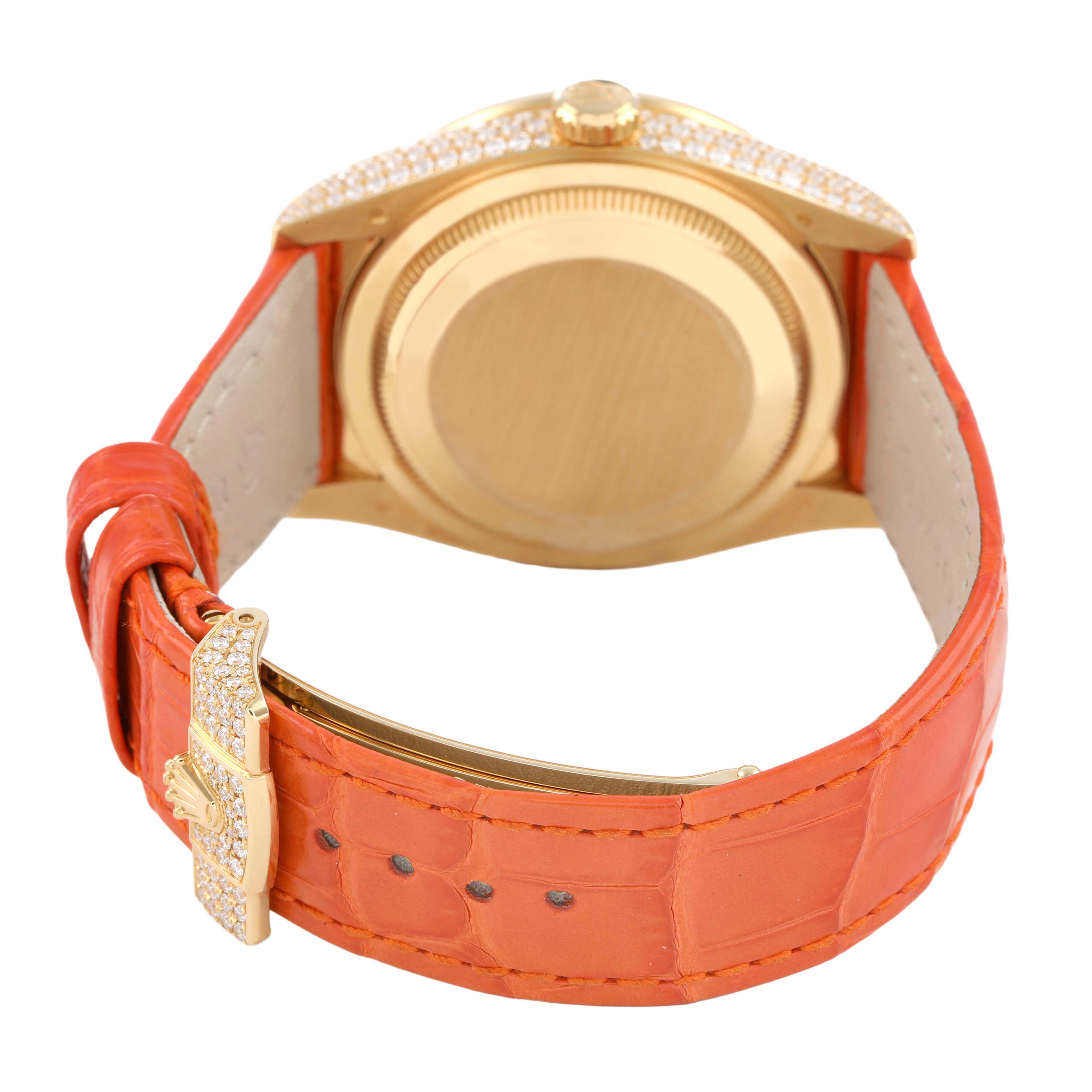 The image shows the back case and strap of a Rolex President 128158RBR Men's Yellow Gold Champagne Dial model, featuring a gold case and orange leather strap.