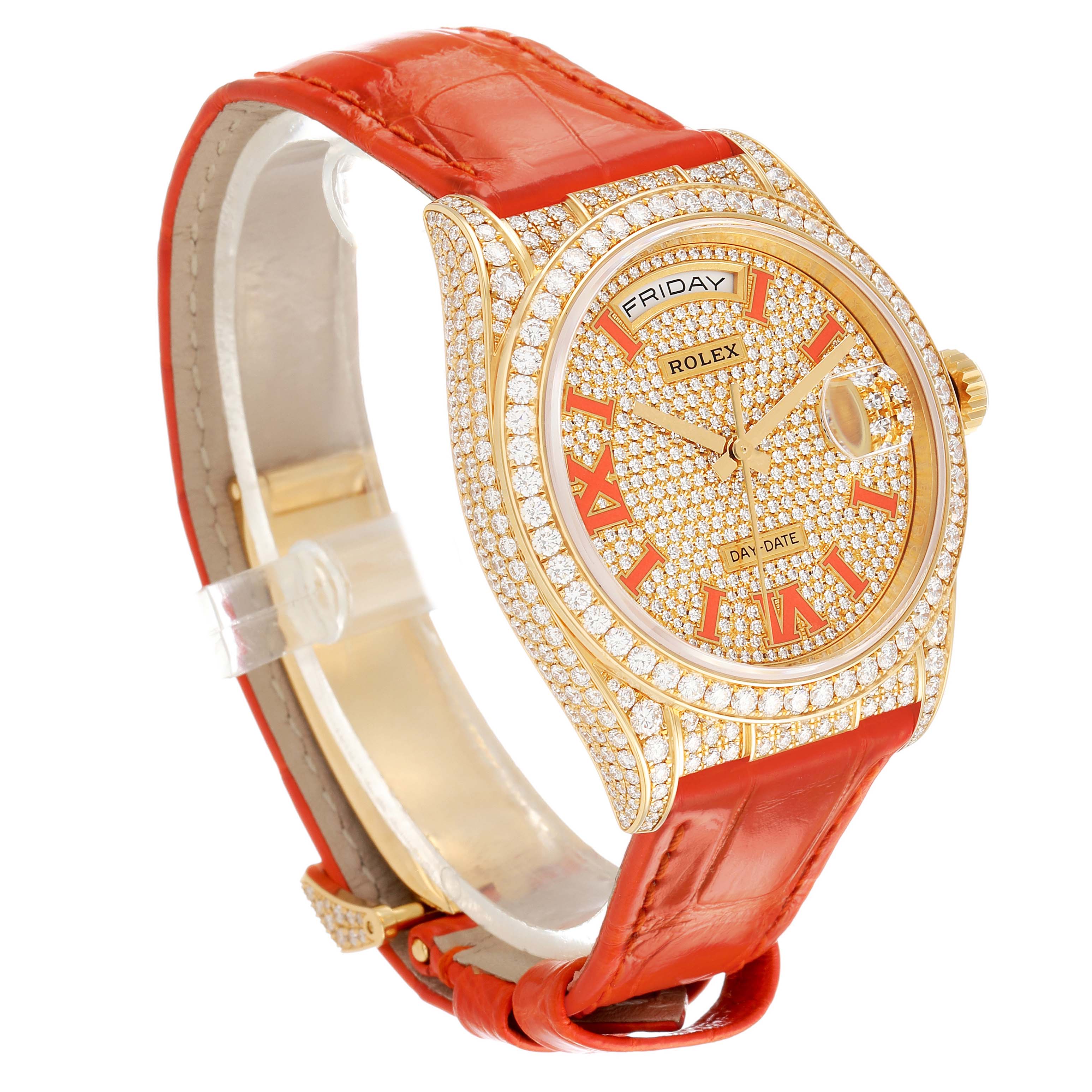 The Rolex President 128158RBR Men's Yellow Gold Champagne Dial watch is shown at a three-quarter angle, highlighting the diamond-encrusted bezel, dial, and red Roman numerals with a red leather strap.