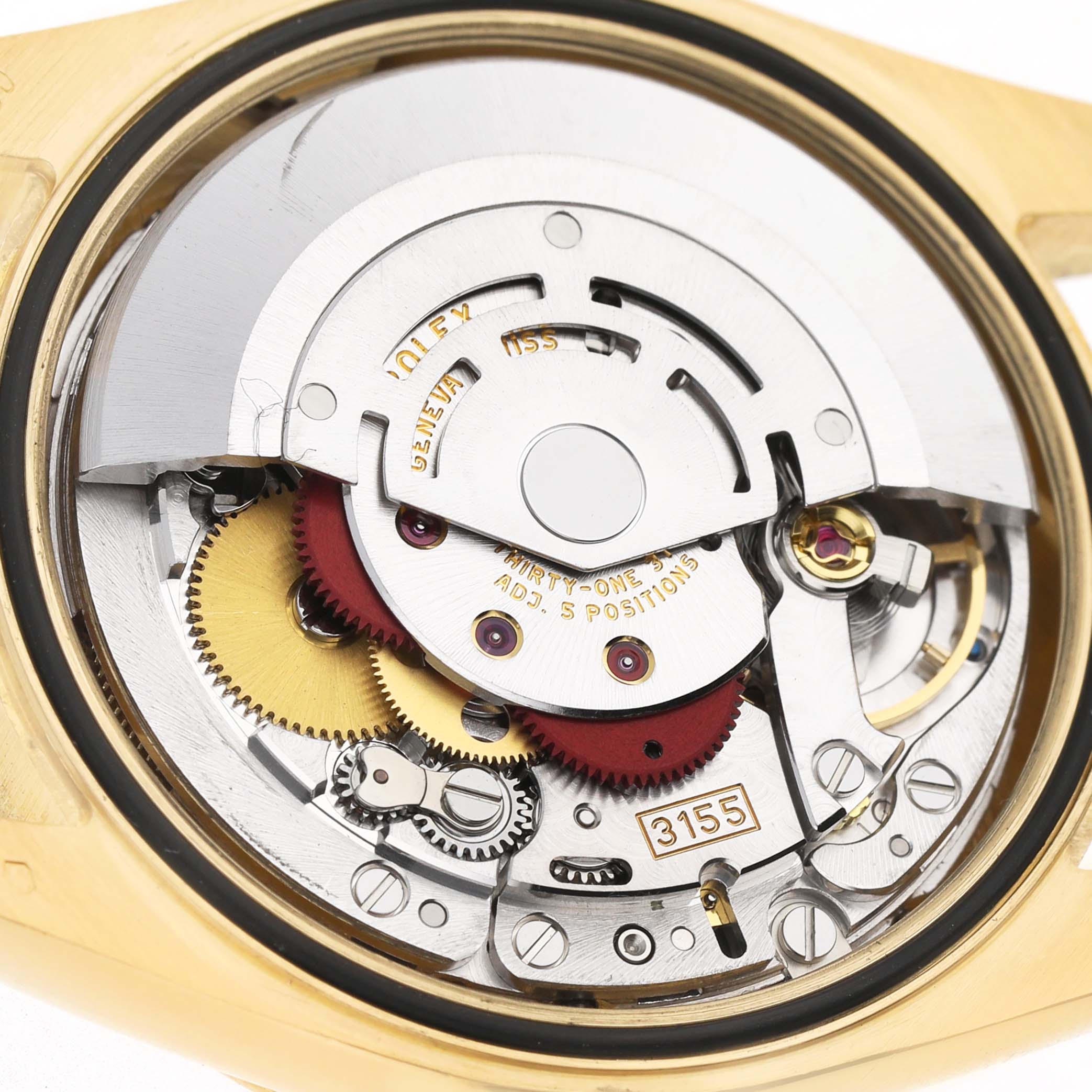 The image shows the internal movement of a Rolex President 118238 Men's Yellow Gold Champagne Dial model watch from a close-up angle, highlighting gears and mechanisms.