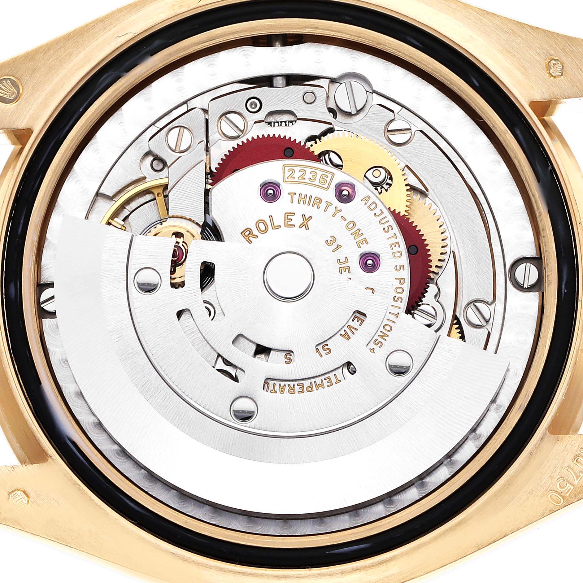 The image shows the inner mechanical movement of a Rolex Mid-Size watch from a top-down angle.