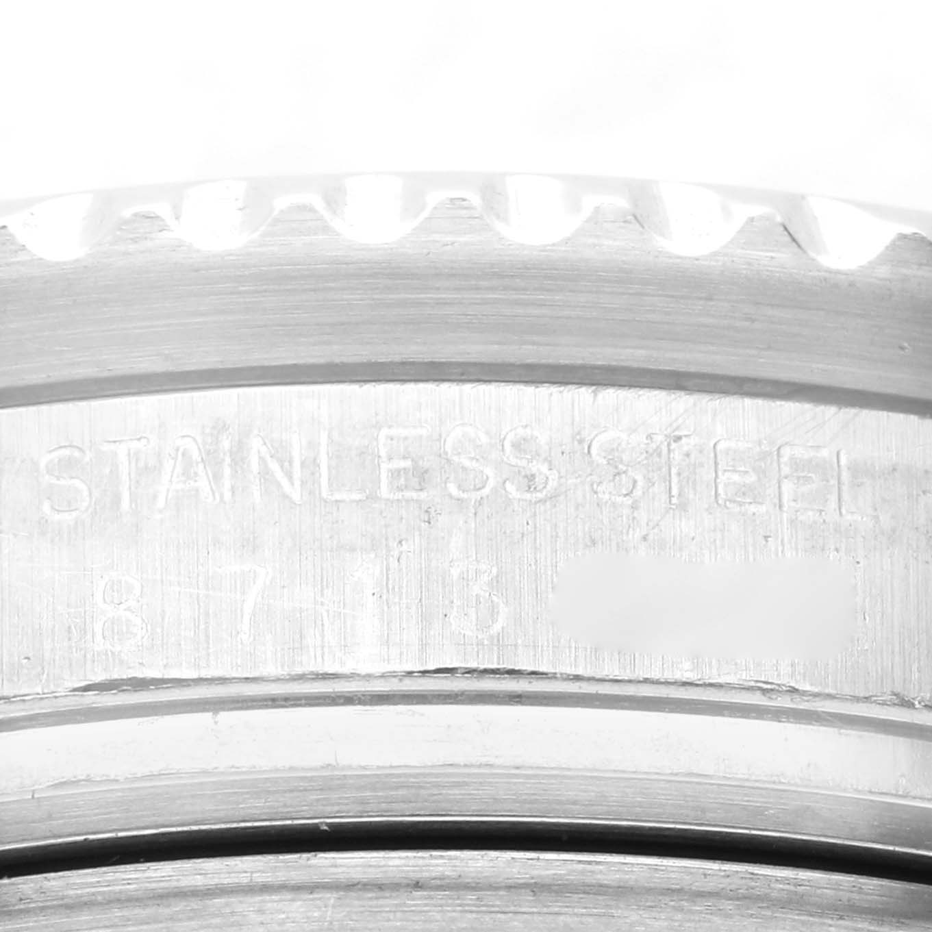 This close-up image of a Rolex Sea-Dweller 16660 Men
s Stainless Steel Black Dial 16660 Men
s Stainless Steel Black Dial watch displays the engraved text on its stainless steel bezel.