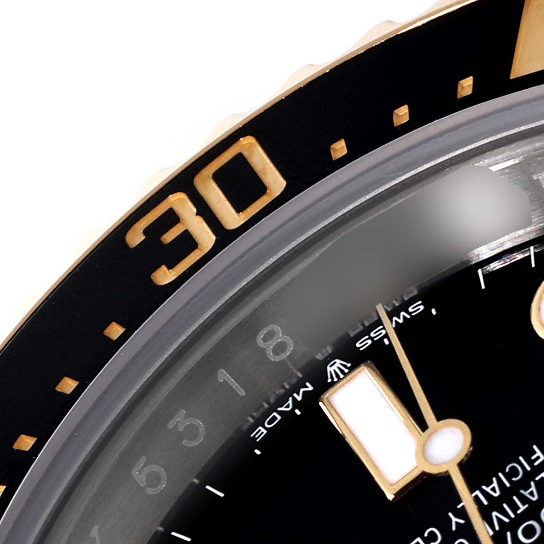 The image shows a close-up of the bezel, dial, and part of the minute hand of a Rolex Sea-Dweller 126603 Men's Steel and Gold (two tone) Black Dial 126603 Men's Steel and Gold (two tone) Black Dial watch.