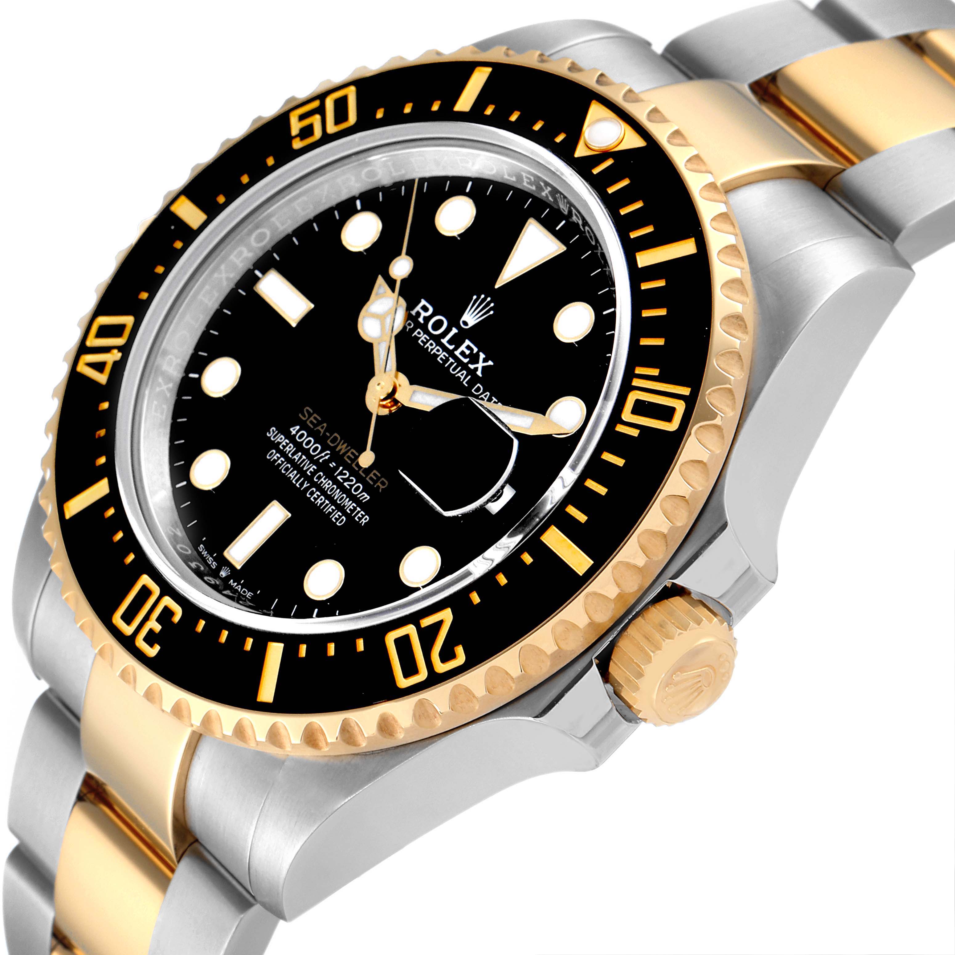 The image shows a close-up, side angle of the Rolex Sea-Dweller 126603 Men's Steel and Gold (two tone) Black Dial 126603 Men's Steel and Gold (two tone) Black Dial, highlighting the black bezel, crown, and part of the bracelet.