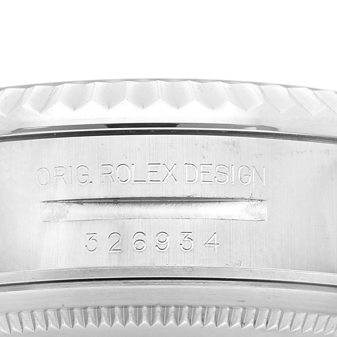 This image shows a close-up of the side of a Rolex Sky-Dweller 326934 Men
s Stainless Steel Black Dial 326934 Men
s Stainless Steel Black Dial, highlighting the engraved model number and "ORIG. ROLEX DESIGN."