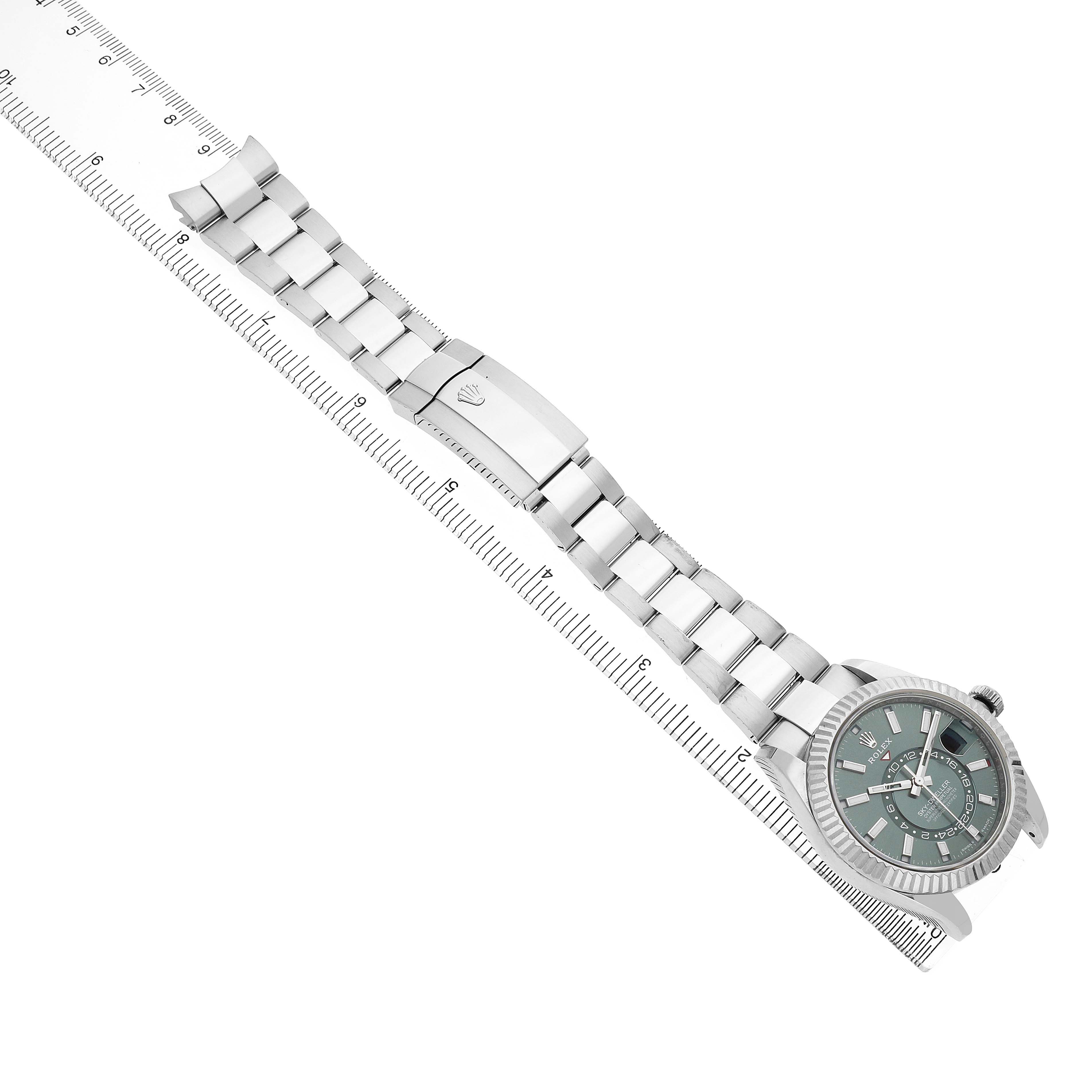 The Rolex Sky-Dweller 336934 Men's Stainless Steel Green Dial is displayed flat, showcasing the full bracelet, clasp, and partial dial.