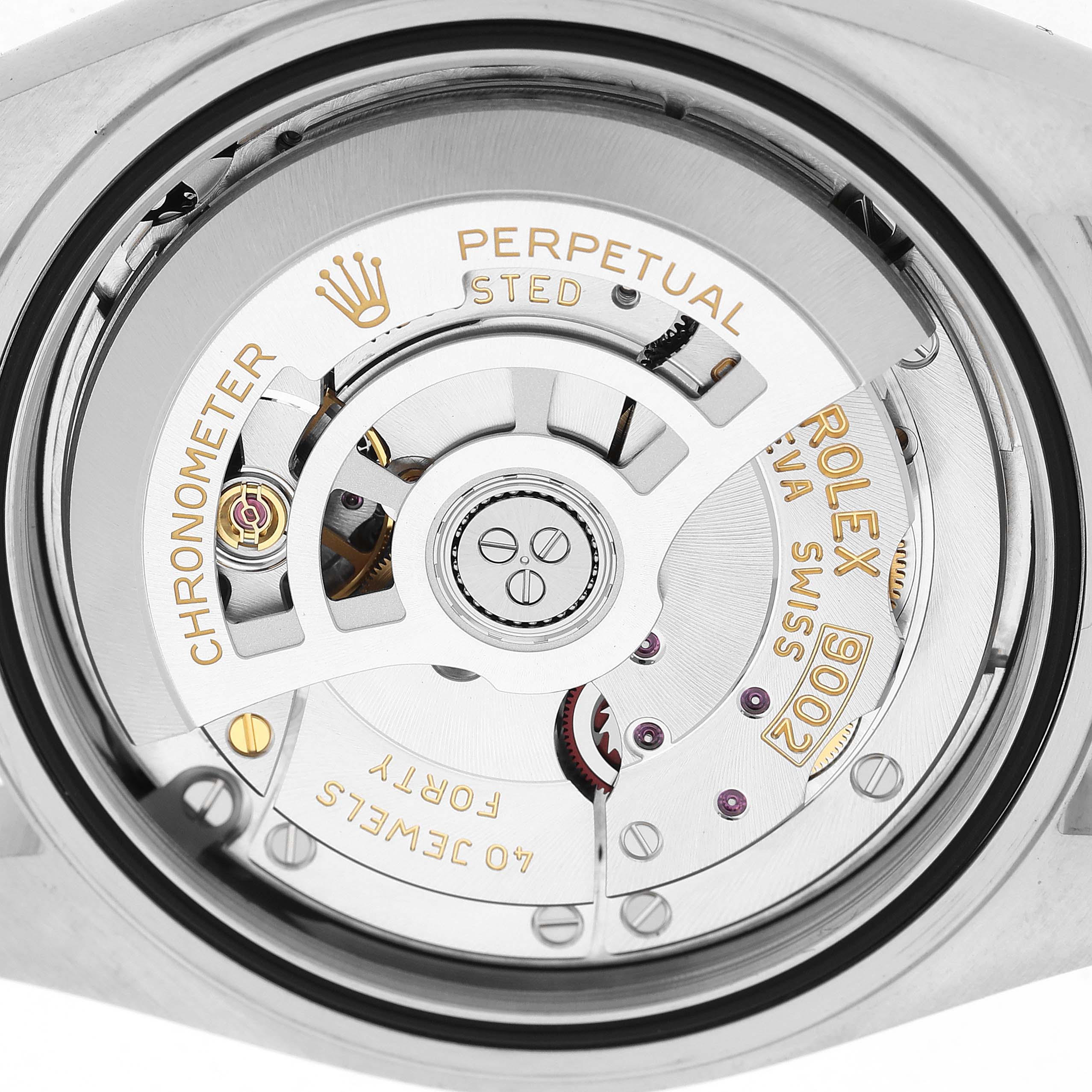 The image shows a close-up of the Rolex Sky-Dweller 336934 Men's Stainless Steel Green Dial's movement through the case back, highlighting the rotor and inner mechanisms.