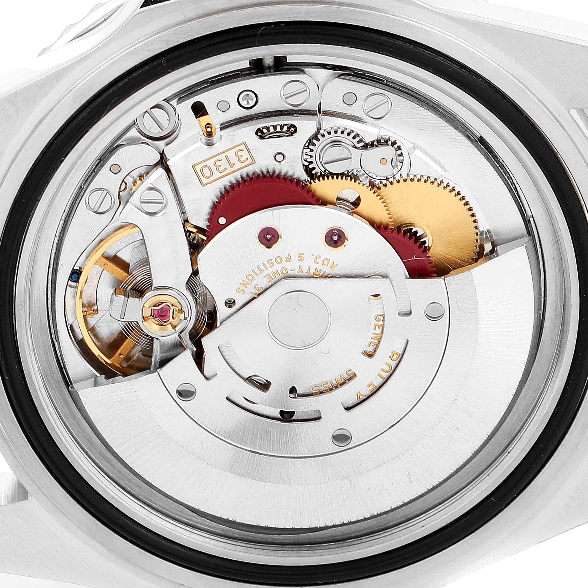 The image shows the rear view of the Rolex Submariner 14060M Men
s Stainless Steel Black Dial 14060M Men
s Stainless Steel Black Dial
s movement mechanism, highlighting its internal gears and components.