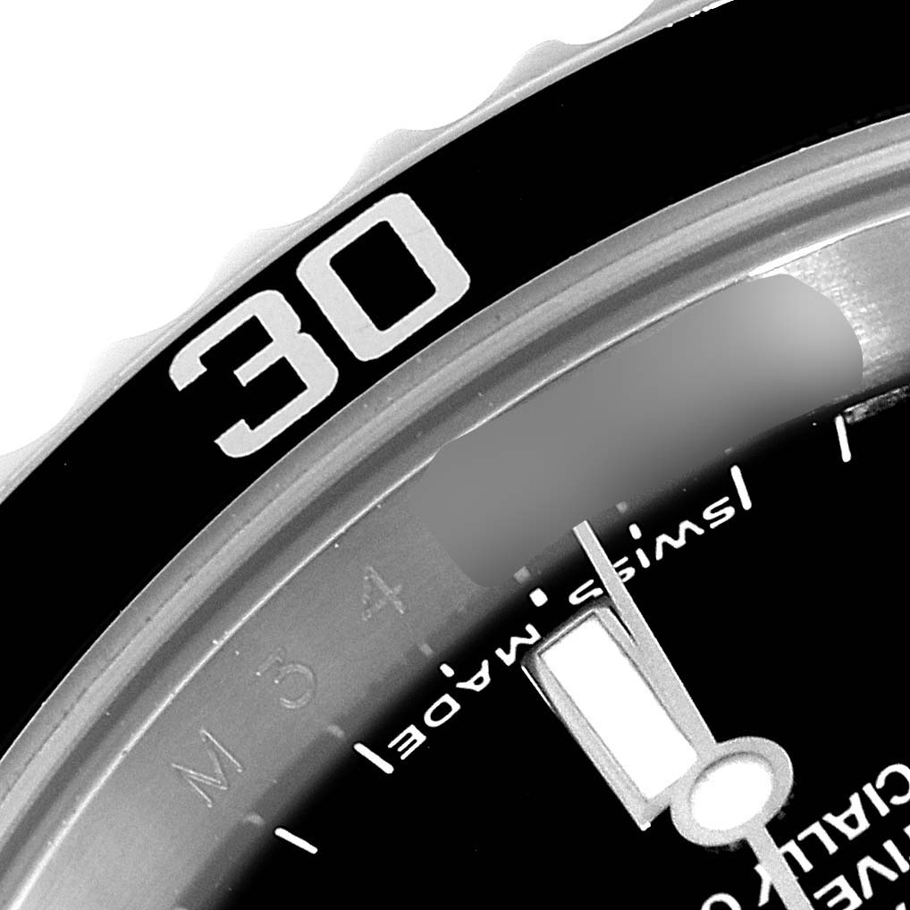 This close-up image shows the bezel and part of the dial of a Rolex Submariner 14060M Men
s Stainless Steel Black Dial 14060M Men
s Stainless Steel Black Dial watch, including the "30" marking on the bezel.