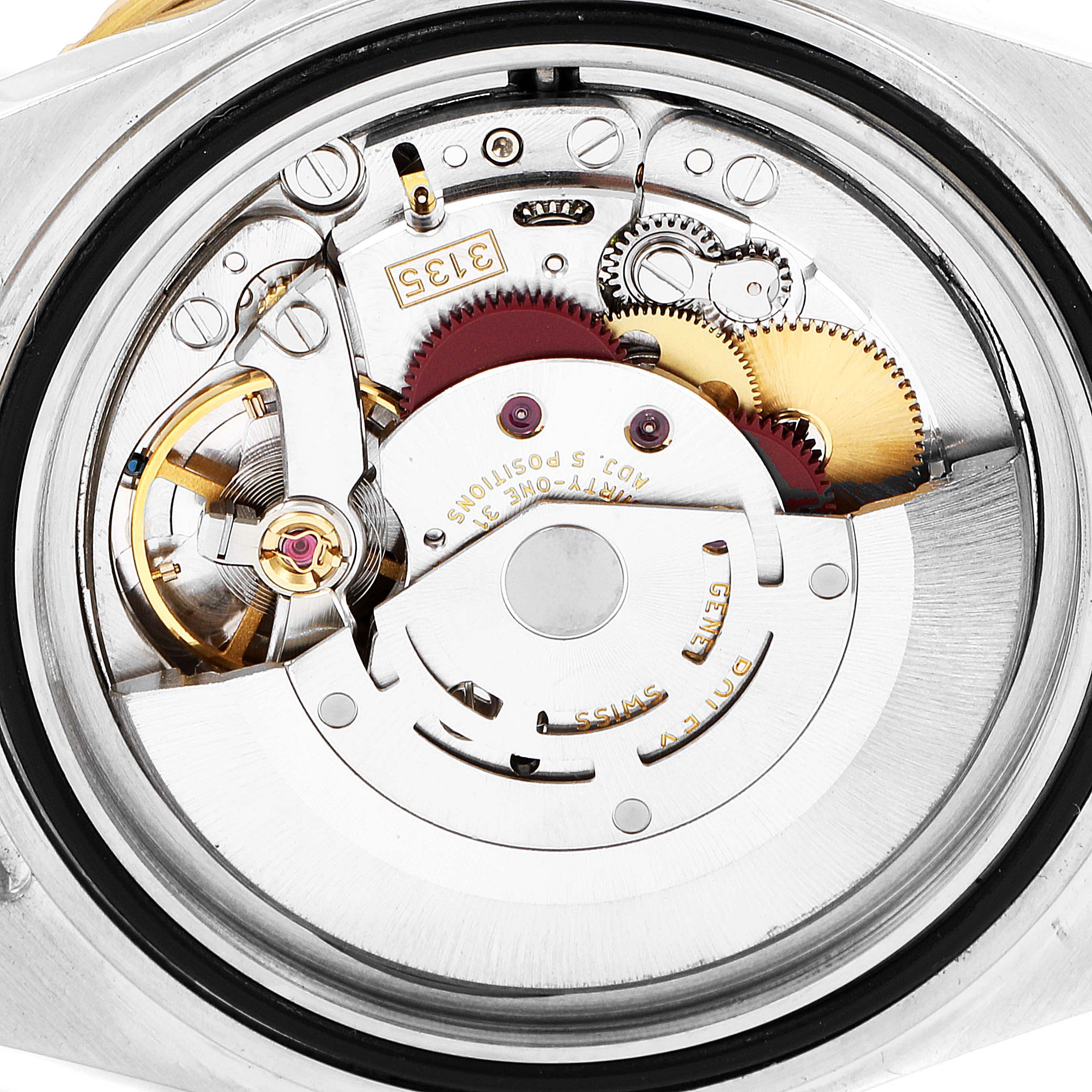 This image shows the internal movement components of a Rolex Submariner 16613 Men
s Steel and Gold (two tone) Blue Dial 16613 Men
s Steel and Gold (two tone) Blue Dial watch viewed from the back.