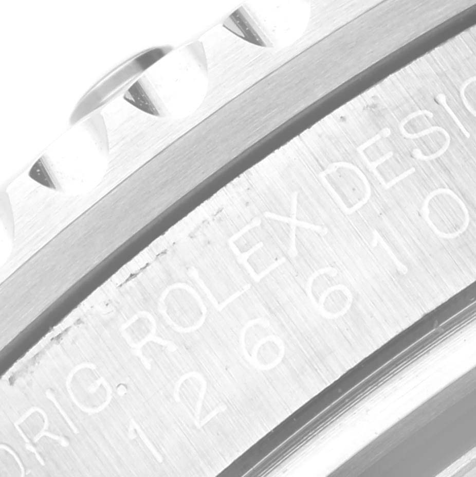 This close-up image shows the engraved case side of a Rolex Submariner 126610LV Men
s Stainless Steel Black Dial 126610LV Men
s Stainless Steel Black Dial watch, highlighting the model and brand details.