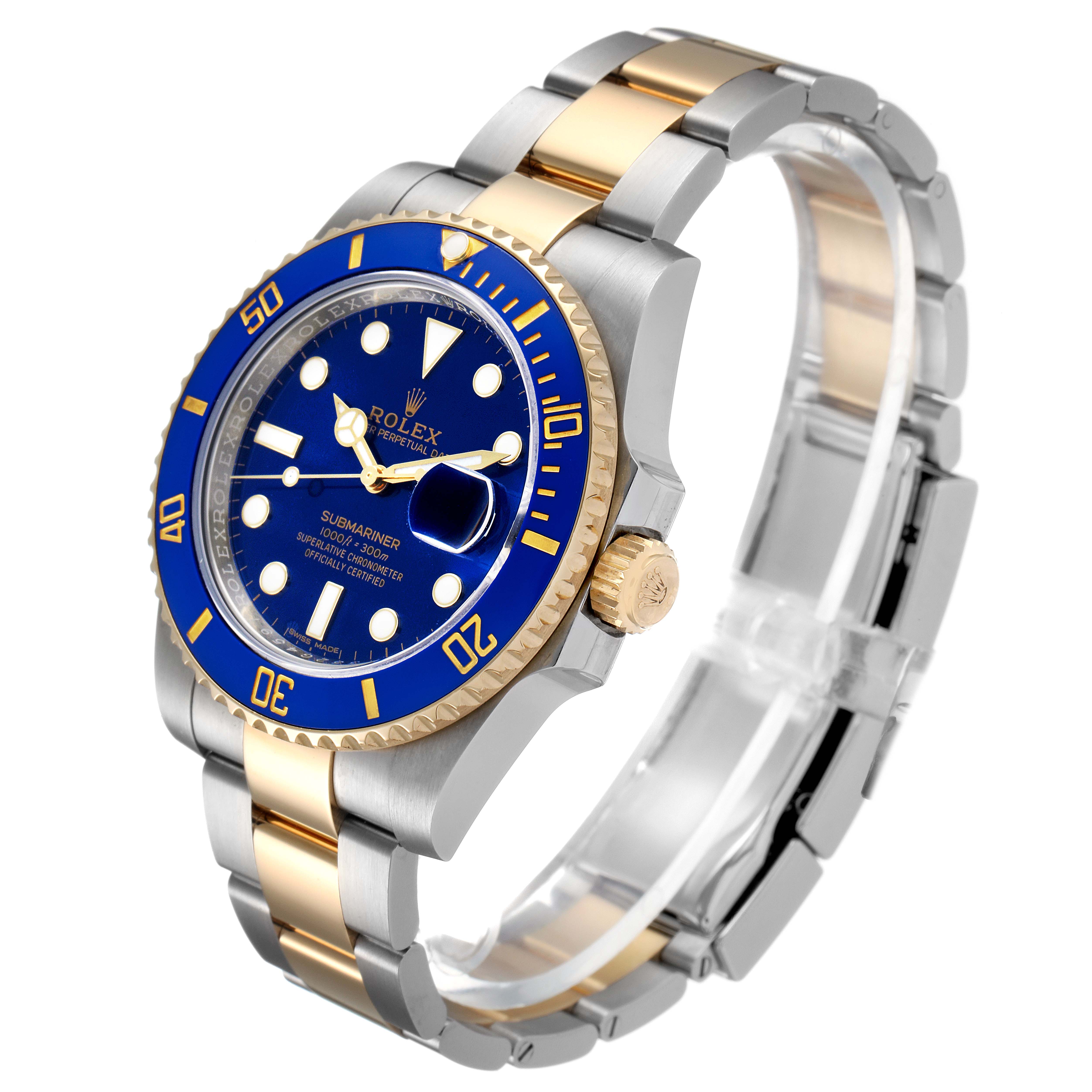 The Rolex Submariner 116613 Men
s Steel and Gold (two tone) Blue Dial 116613 Men
s Steel and Gold (two tone) Blue Dial watch is shown from an angled view highlighting the blue dial, two-tone bracelet, and prominent bezel.