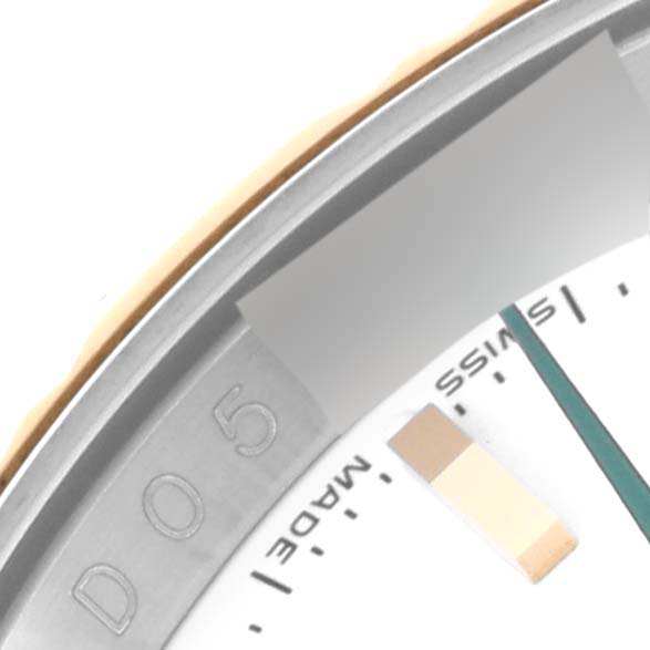 The image shows a close-up of the dial and part of the bezel of a Rolex Turn-o-Graph 116263 Men
s Steel and Gold (two tone) White Dial 116263 Men
s Steel and Gold (two tone) White Dial watch, highlighting the "Swiss Made" text and a portion of a hand.