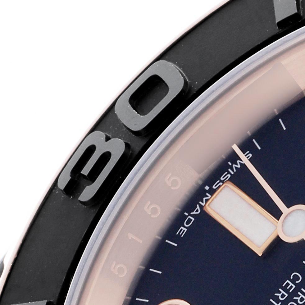 The image shows a close-up of the bezel and part of the dial of a Rolex Yacht-Master 116655 Men
s Rose Gold Black Dial 116655 Men
s Rose Gold Black Dial watch.