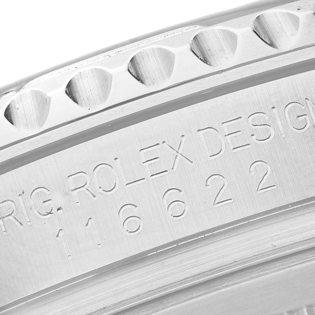 This close-up image shows the engraved model and serial number on the side of a Rolex Yacht-Master 116622 Men's Stainless Steel Silver Dial 116622 Men's Stainless Steel Silver Dial watch bezel.