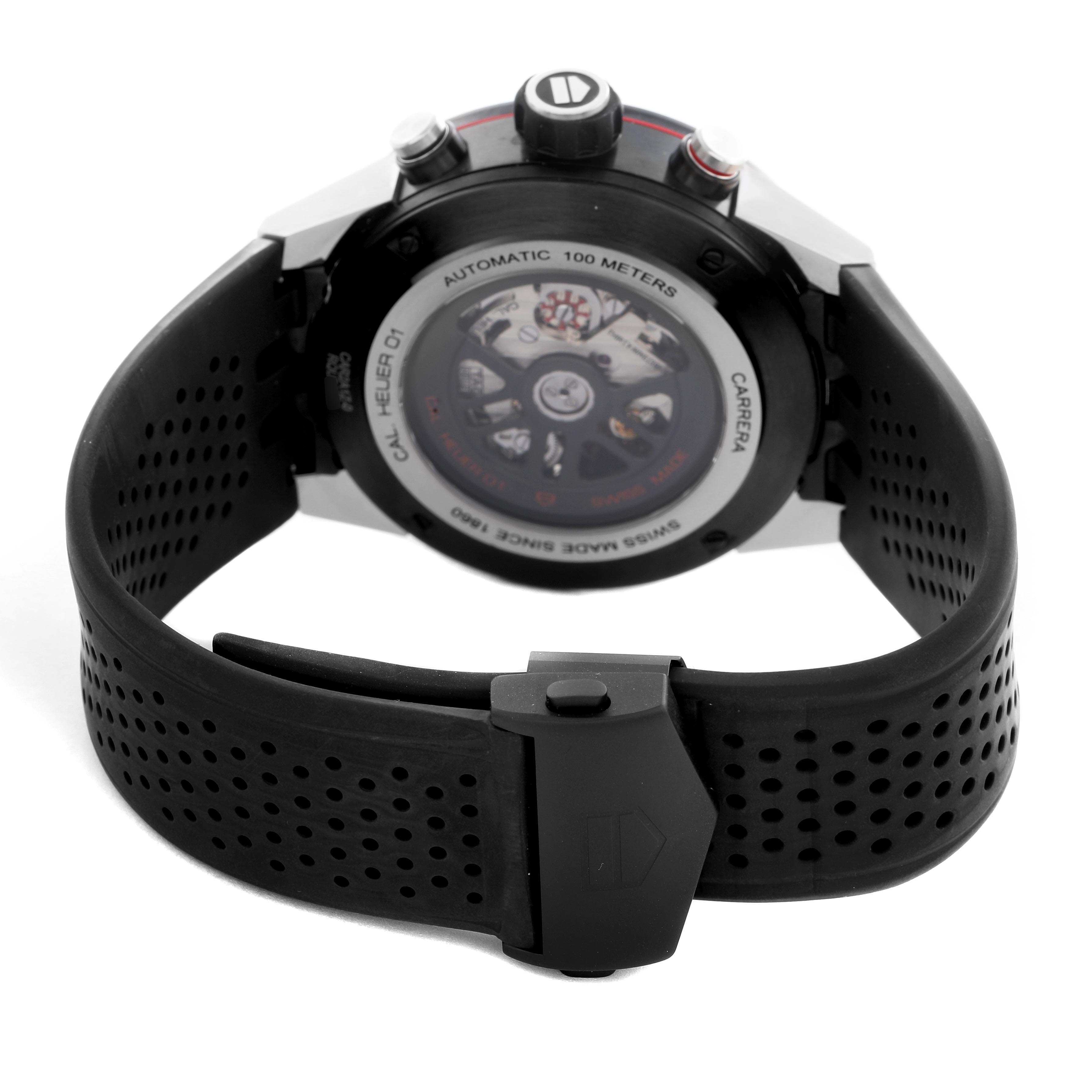 The Tag Heuer Carrera CAR2A1Z Men
s Stainless Steel Black Dial CAR2A1Z Men
s Stainless Steel Black Dial watch is shown from the back, highlighting the automatic movement and perforated black strap.