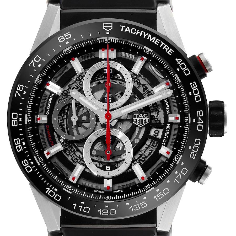 The Tag Heuer Carrera watch is shown from the front, displaying its skeleton dial, tachymeter, and chronograph subdials.
