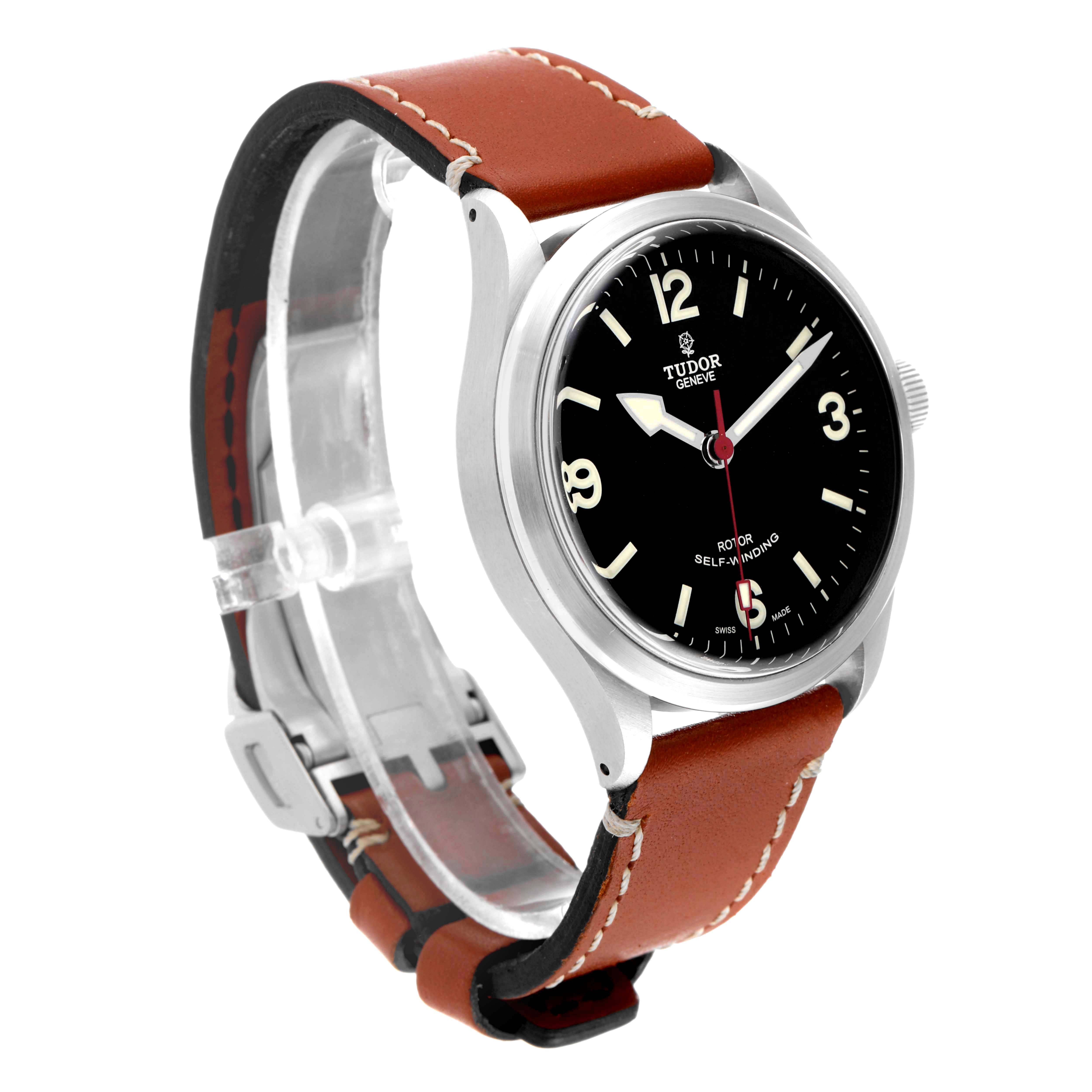 The image shows an angled view of the Tudor Heritage Ranger 79910 Men's Stainless Steel Black Dial 79910 Men's Stainless Steel Black Dial watch, highlighting its black dial, leather strap, and case.