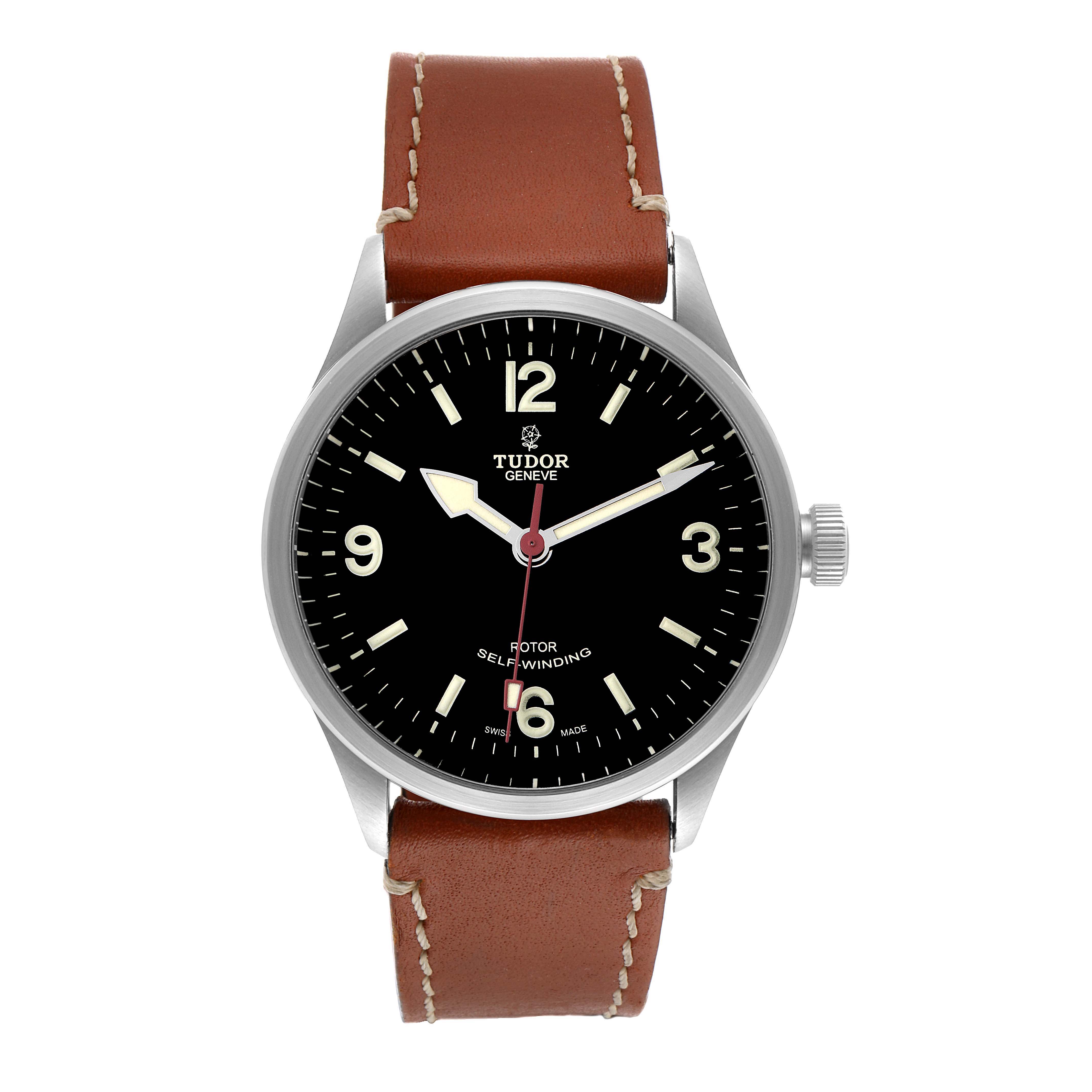 The image shows a front view of the Tudor Heritage Ranger 79910 Men's Stainless Steel Black Dial 79910 Men's Stainless Steel Black Dial watch, highlighting the dial, hands, markers, case, and leather strap.