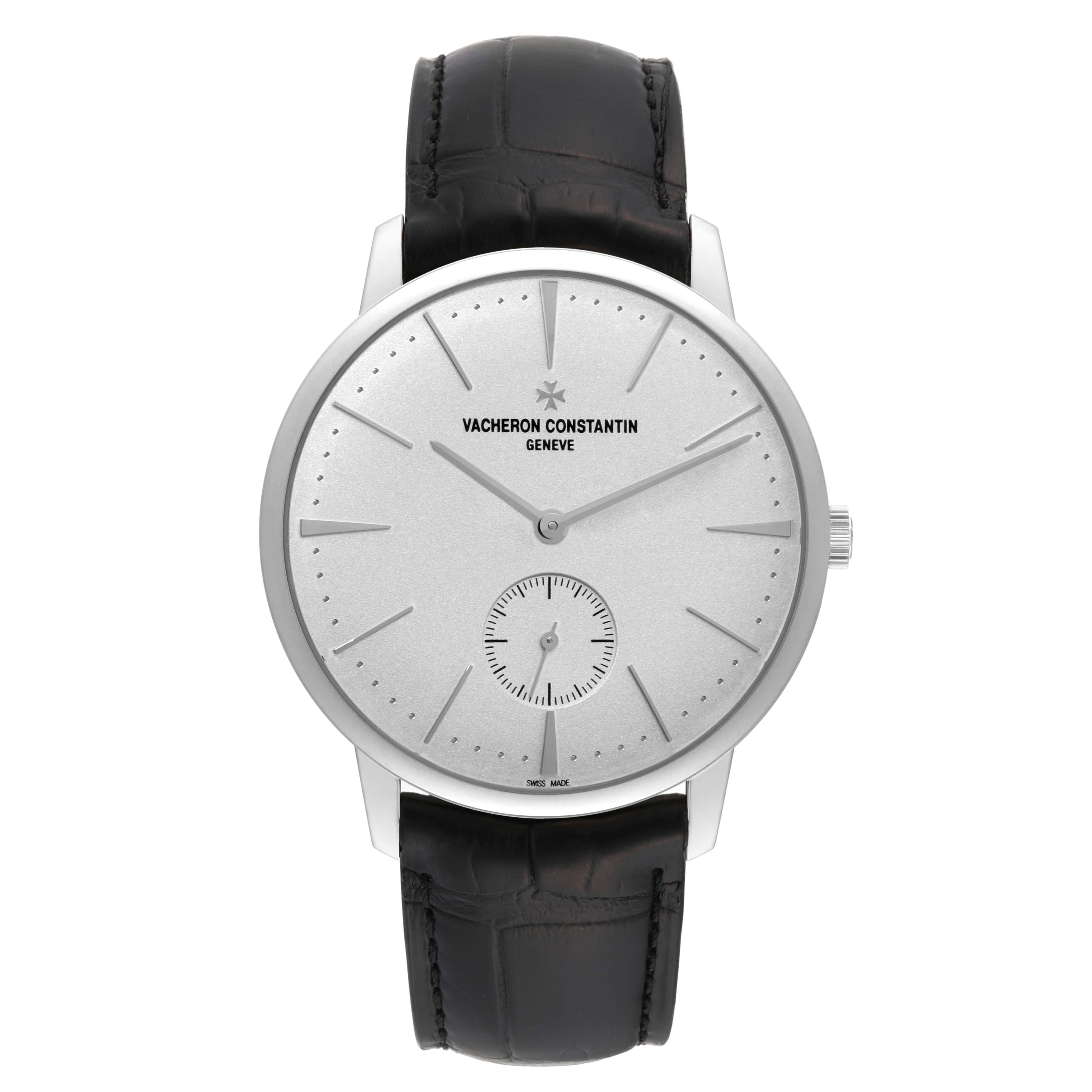 The image shows a front view of a Vacheron Constantin Patrimony 1110U/000G-B086 Men's White Gold Silver Dial 1110U/000G-B086 Men's White Gold Silver Dial watch, featuring a silver dial, sleek markers, and a black leather strap.