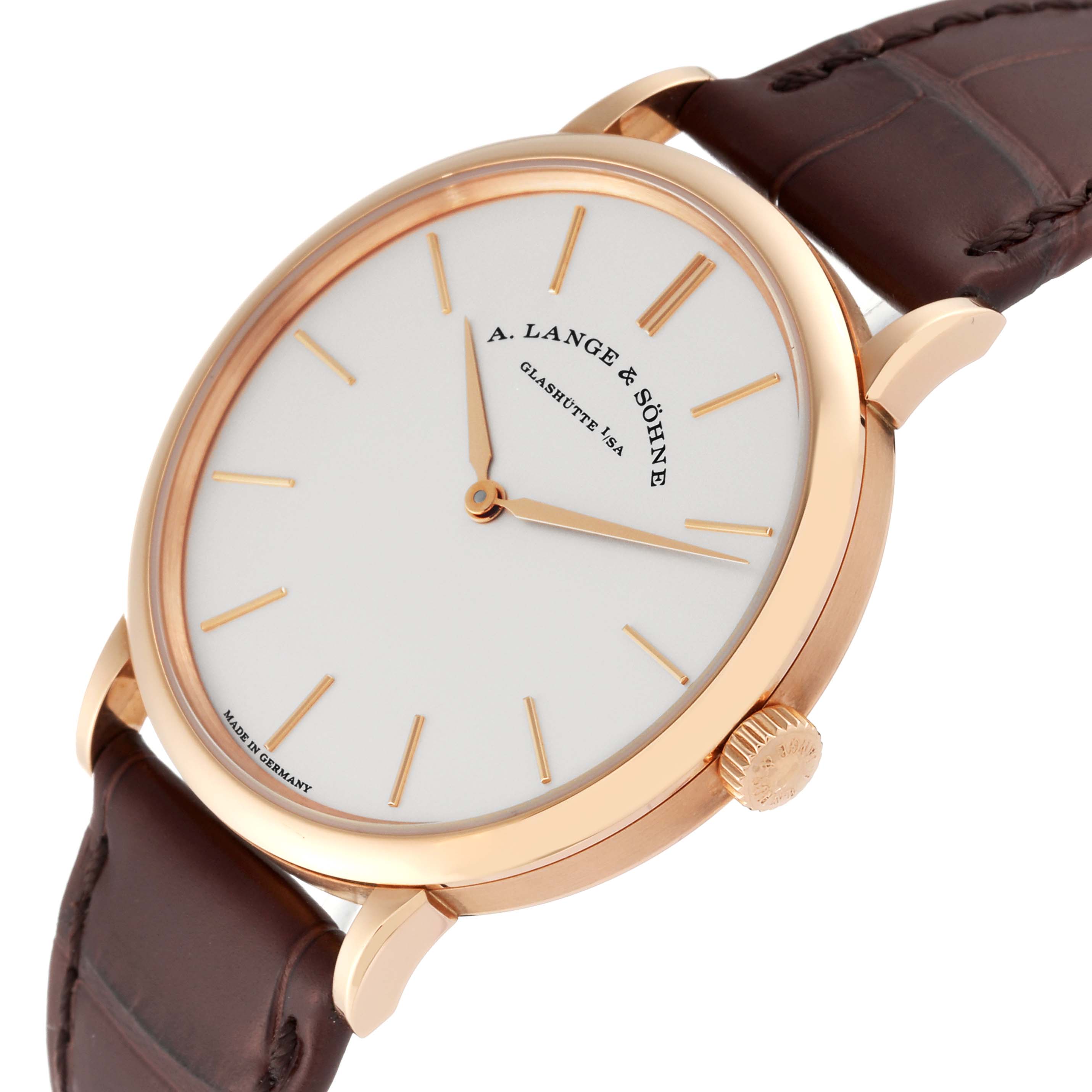 The image shows an angled view of the A. Lange 
Sohne Saxonia 201.033 Men
s Rose Gold Silver Dial watch highlighting the dial, crown, case, and leather strap.