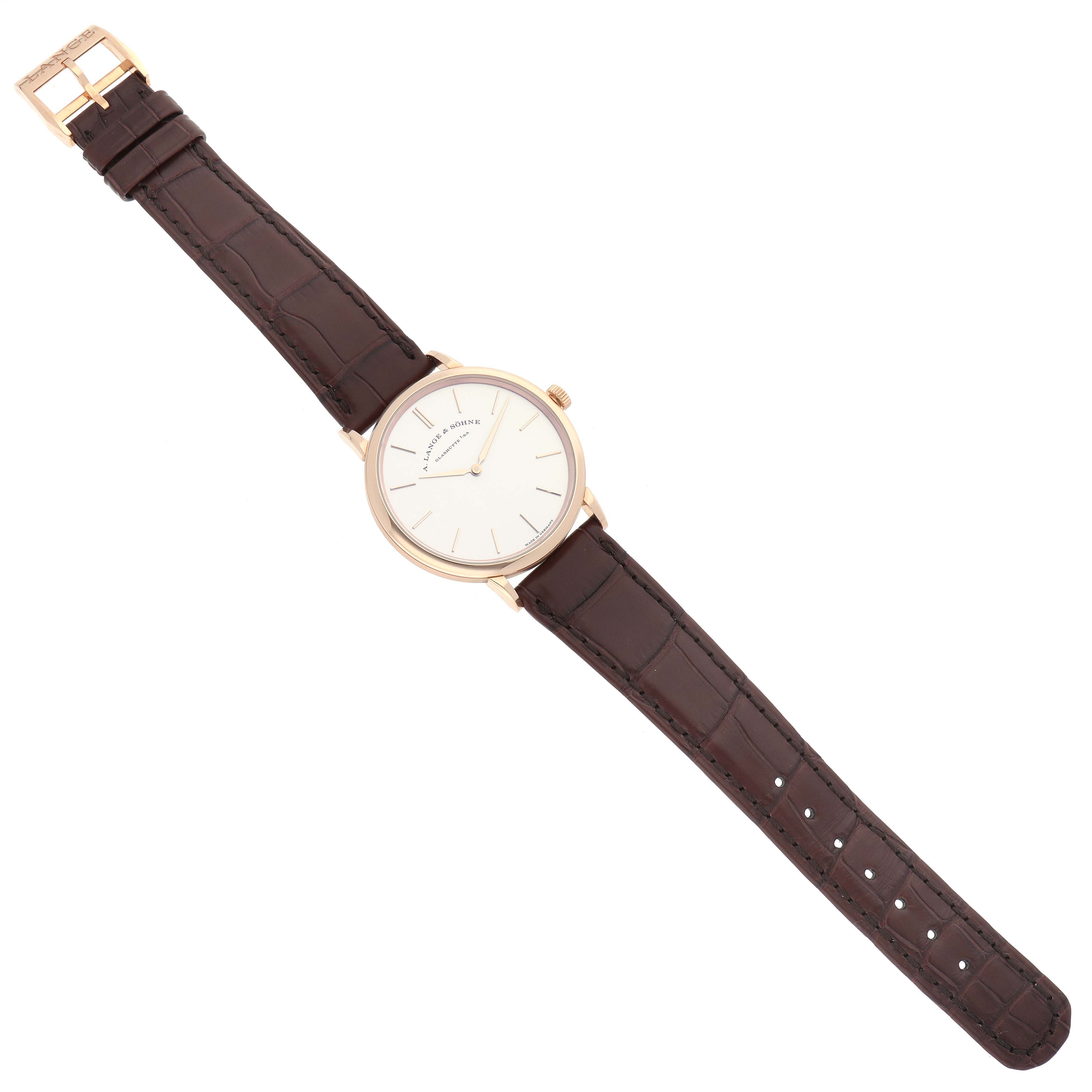 The image shows a top-down view of the Saxonia watch by A. Lange 
Sohne, displaying the entire watch including its dial, case, and leather strap.