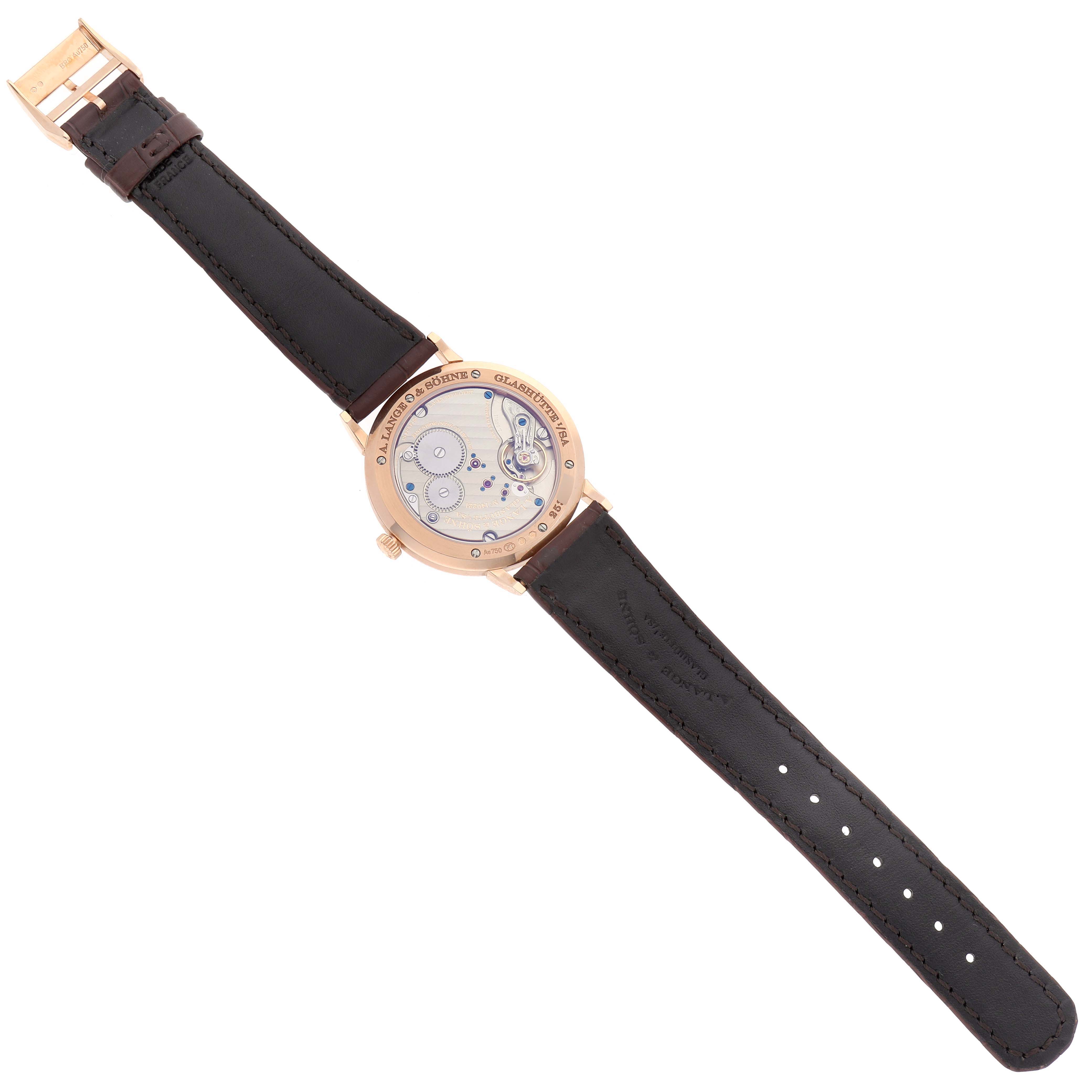 The image shows the reverse side of the A. Lange 
Sohne Saxonia watch, highlighting the movement and leather strap.