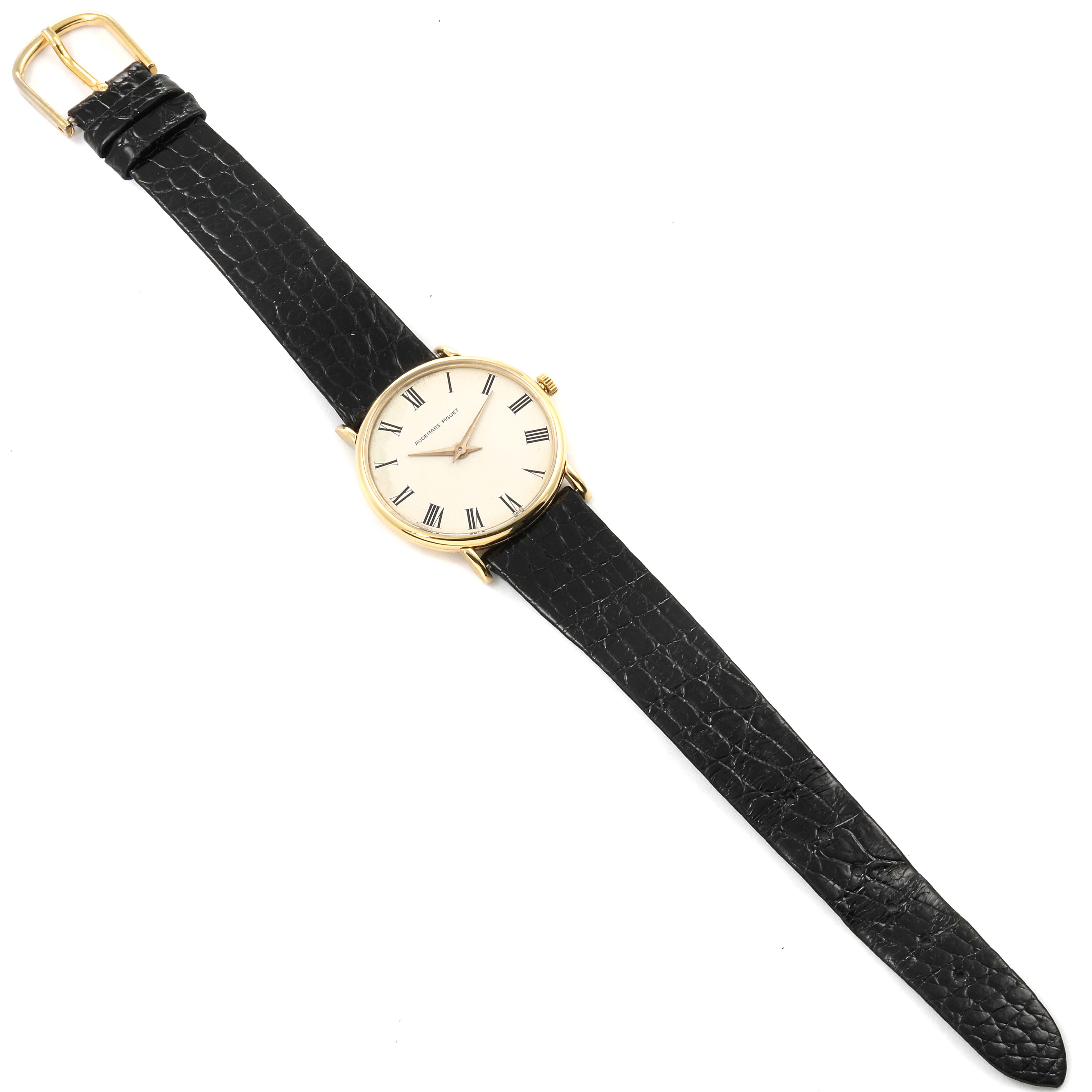 The image shows a full view of a Vintage Audemars Piguet watch with a gold case and black leather strap.