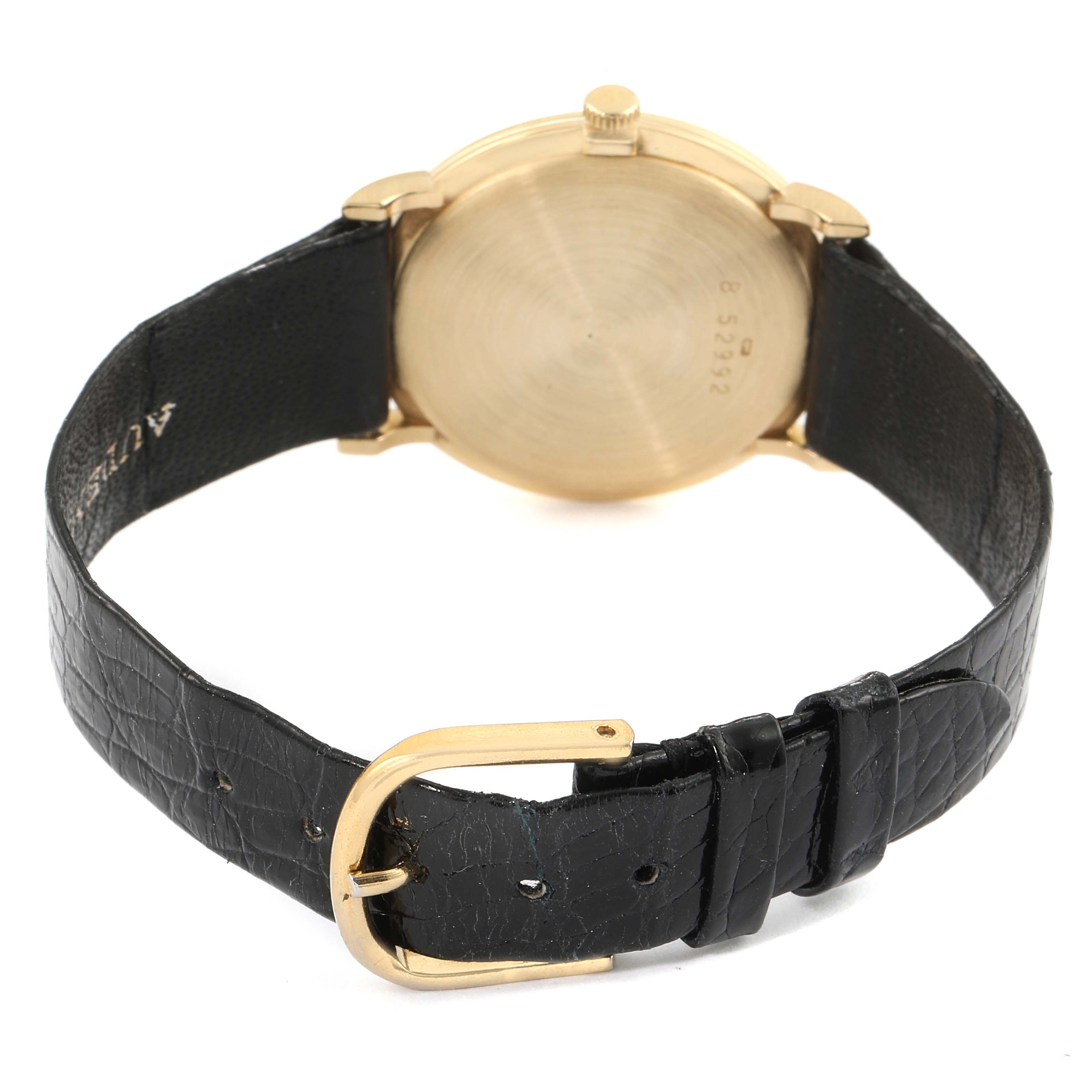 The image shows the back view of a Vintage Audemars Piguet watch, featuring its leather strap and gold buckle.