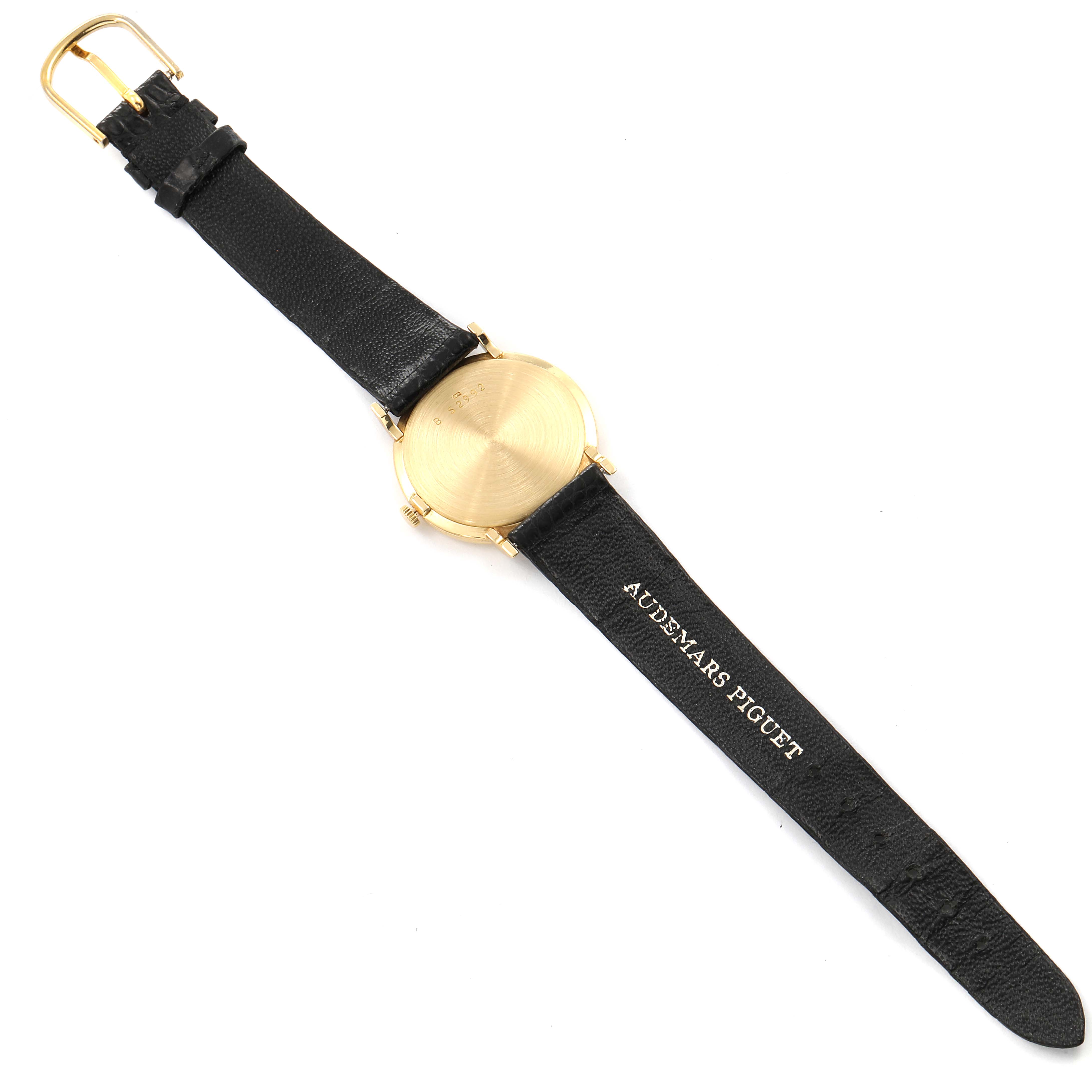 This image shows the back of a Vintage Audemars Piguet watch, displaying its leather strap and gold case.