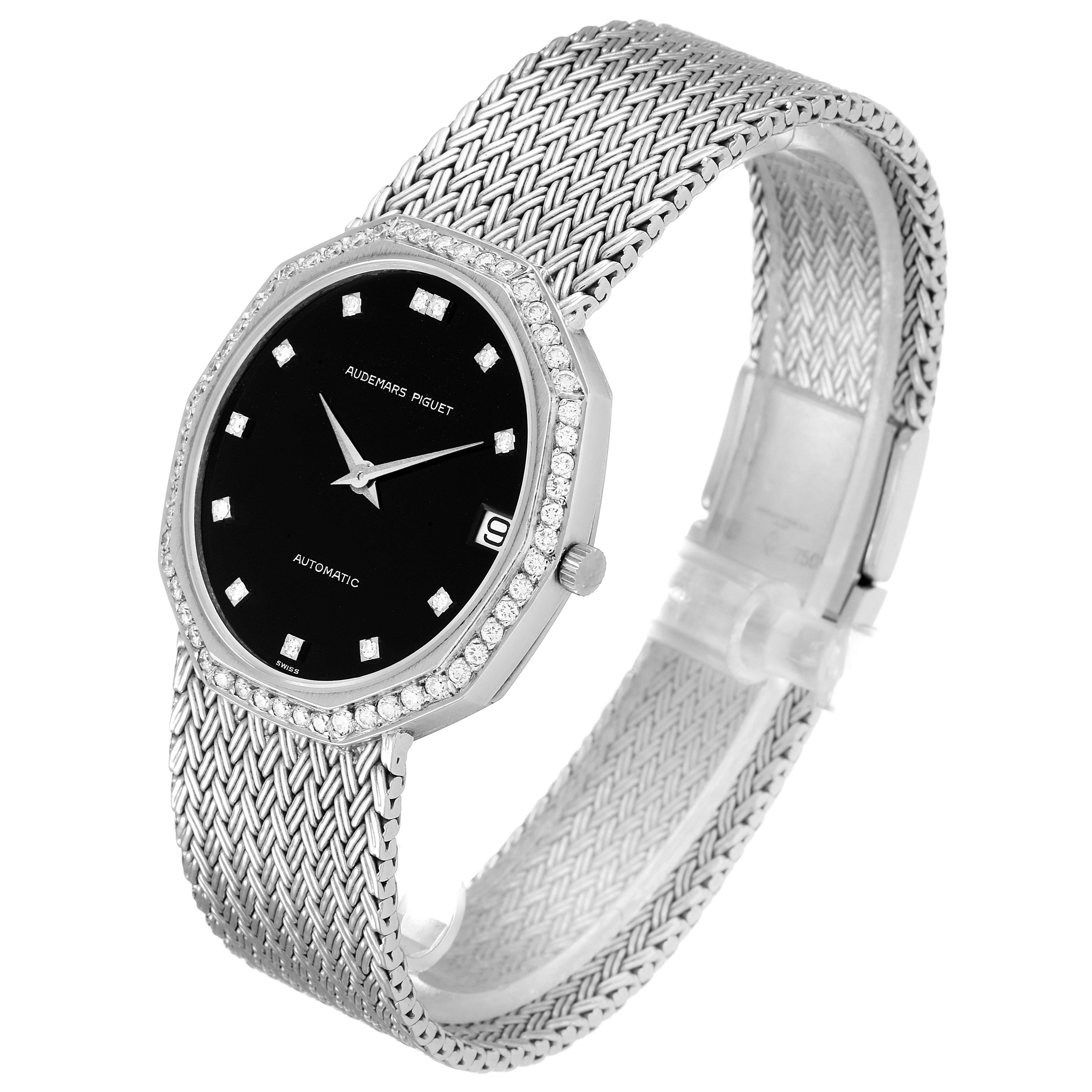 This is a side-angle view of a Vintage Audemars Piguet watch, showing its black dial, diamond-studded bezel, and woven metal bracelet.