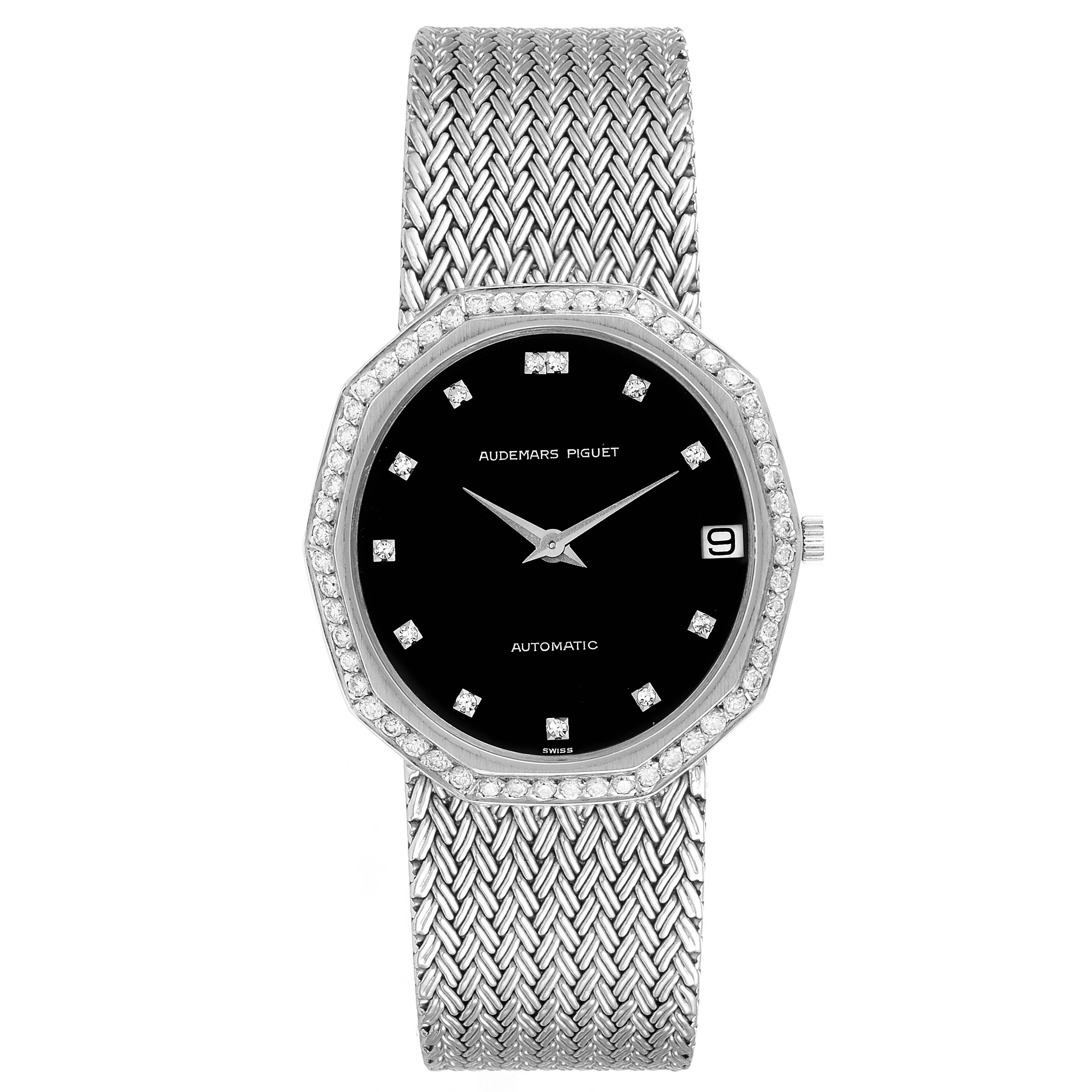 This image shows a front view of a vintage Audemars Piguet watch with a black dial and metal bracelet.