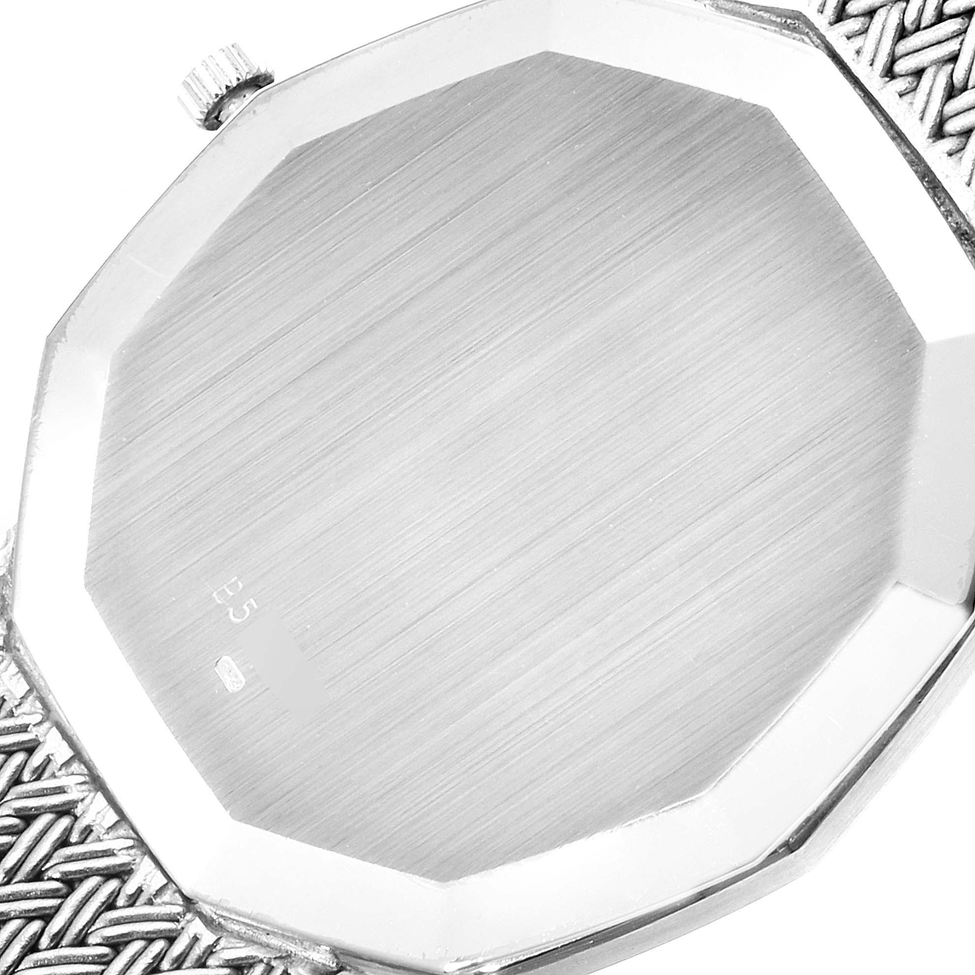 This image shows the back case, crown, and part of the bracelet of a Vintage Audemars Piguet watch.
